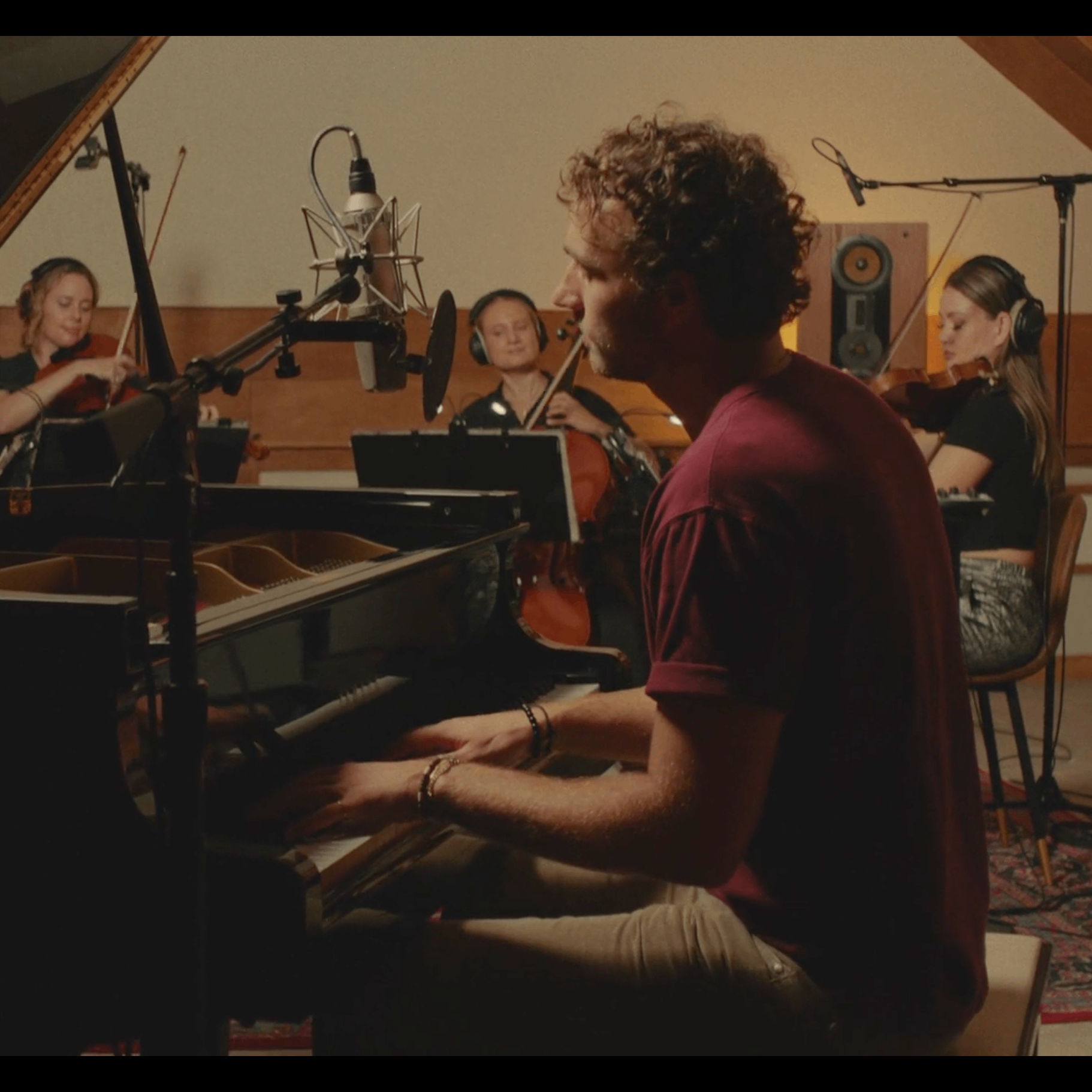 Ryan Delmonico - The Bridge Sessions: a man plays a piano in front of a group of musicians