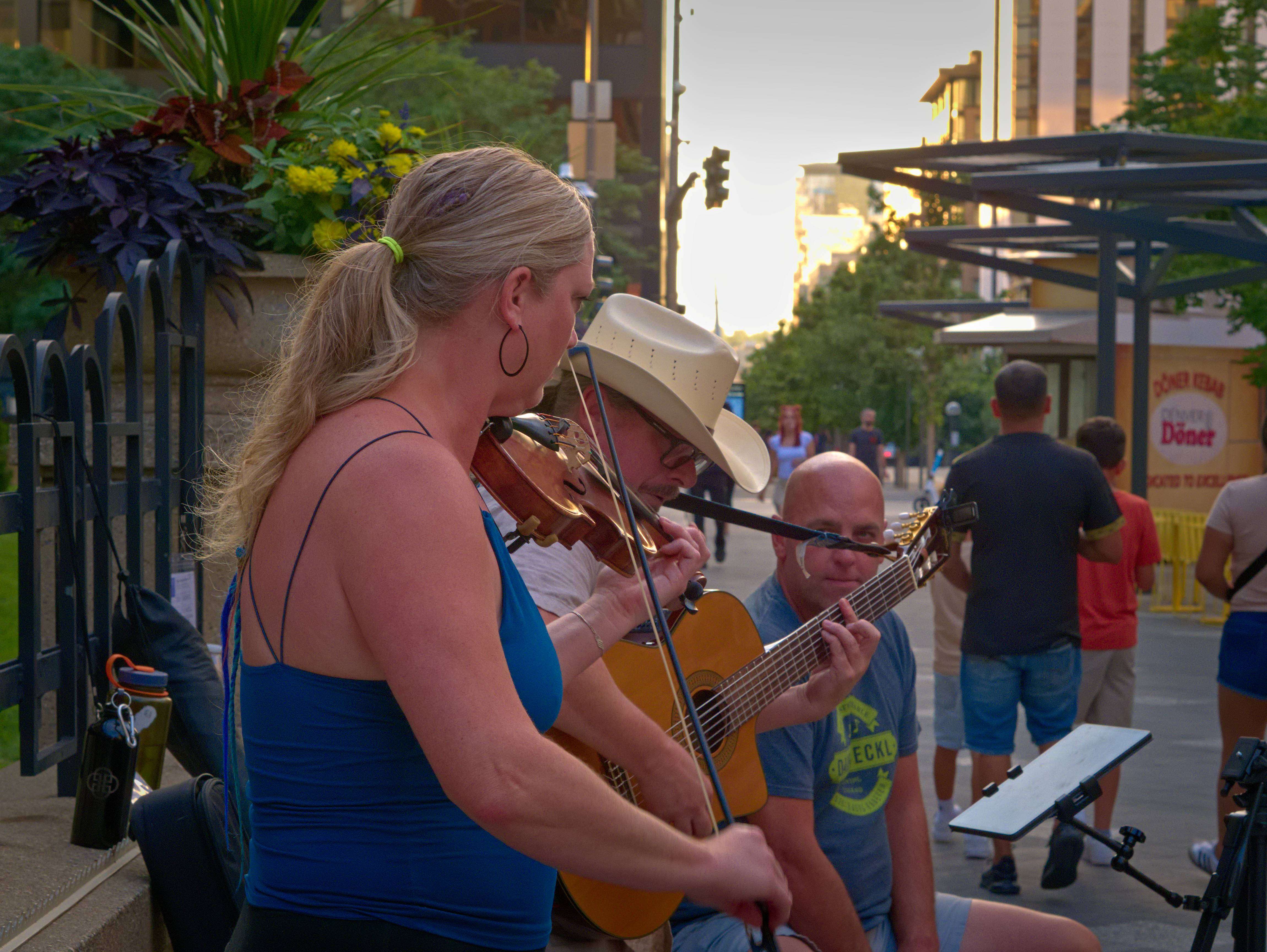 a woman playing a violin