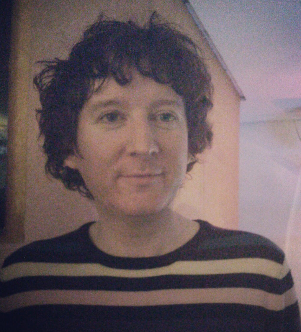 a man wearing a striped sweater