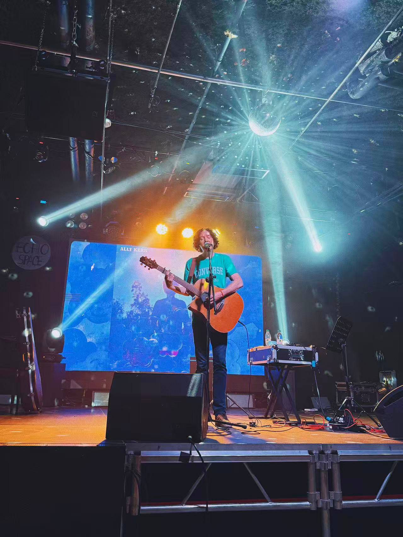 image may contain person, on stage, playing a musical instrument and concert