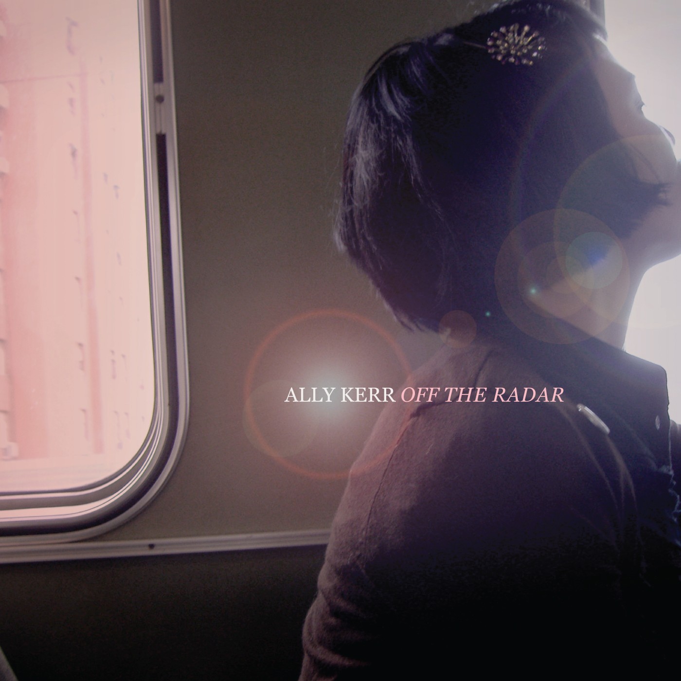 a woman looking out of a train window