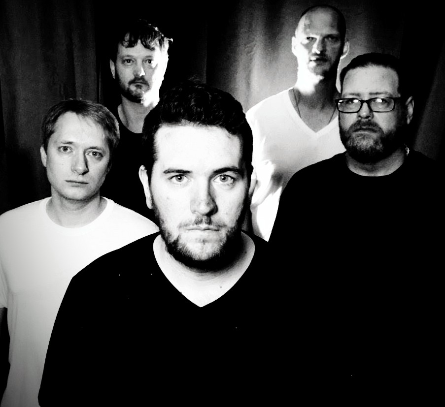a black and white photo of a group of men