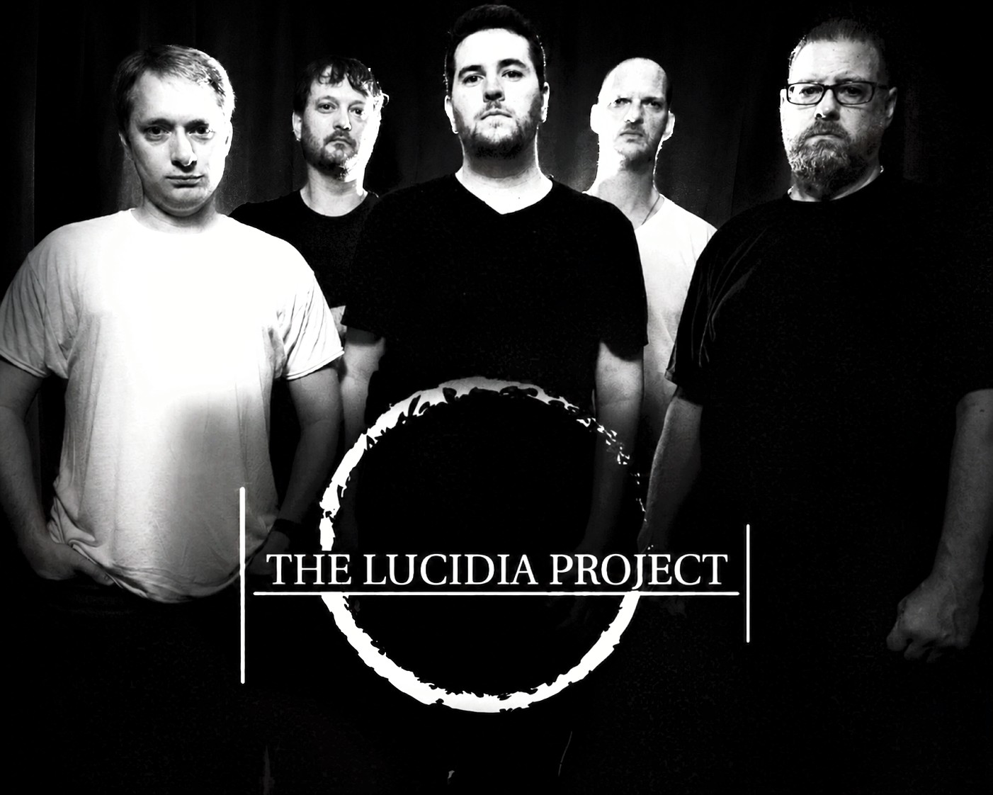 the lucida project is a group of men standing in front of a black background