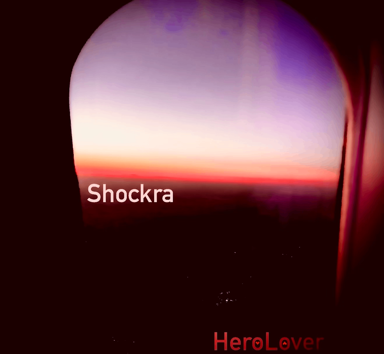 HeroLover - Shockra: a plane window with the words shockra here lover