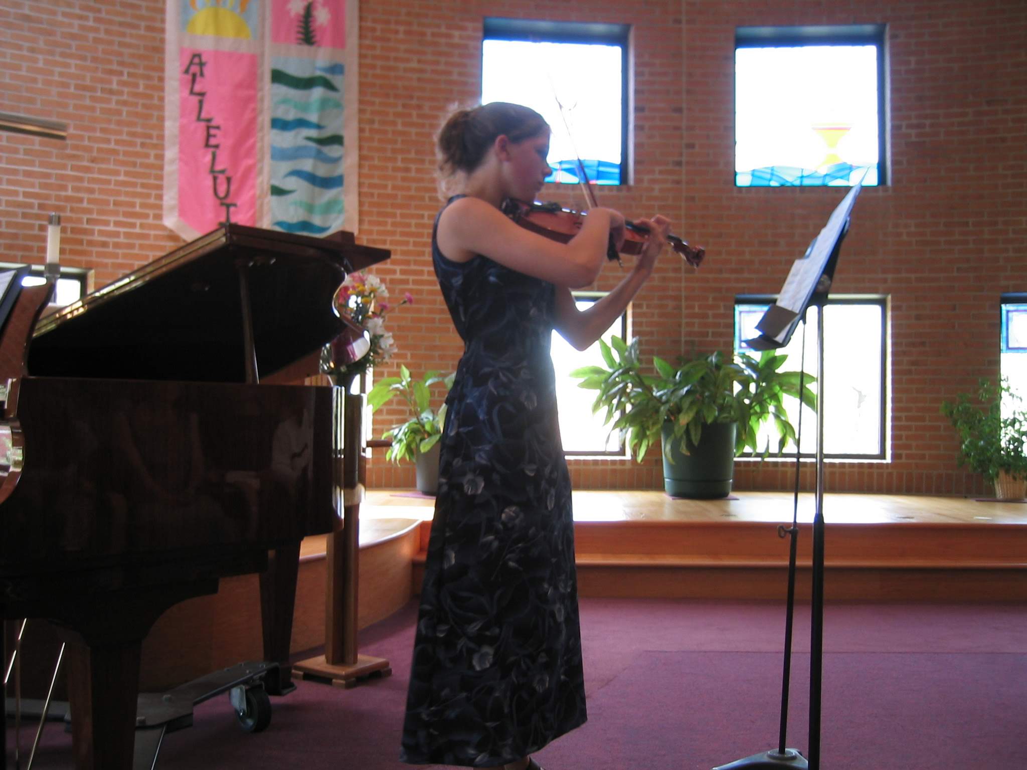 a woman playing a violin