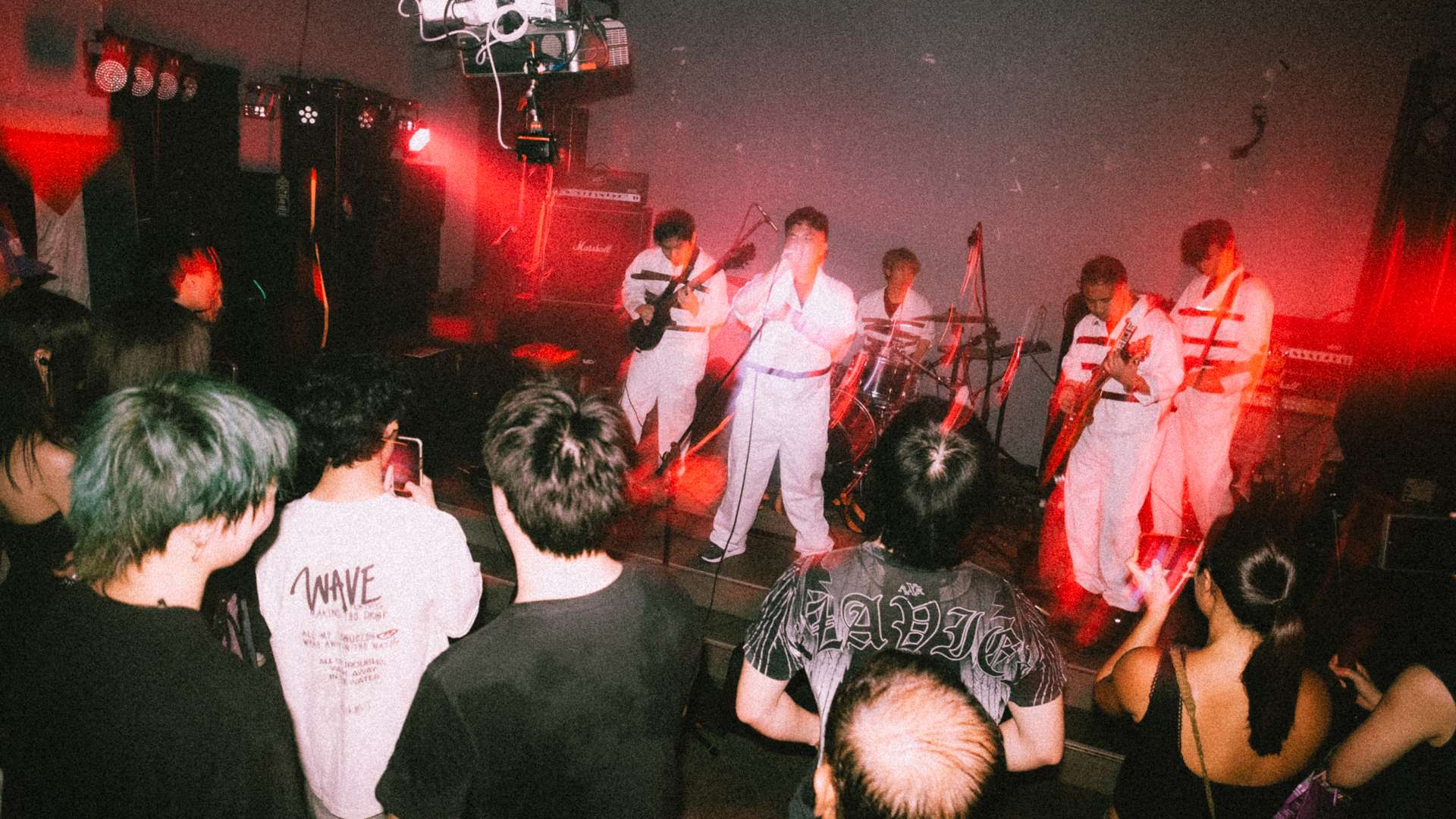 a group of people on stage at a concert