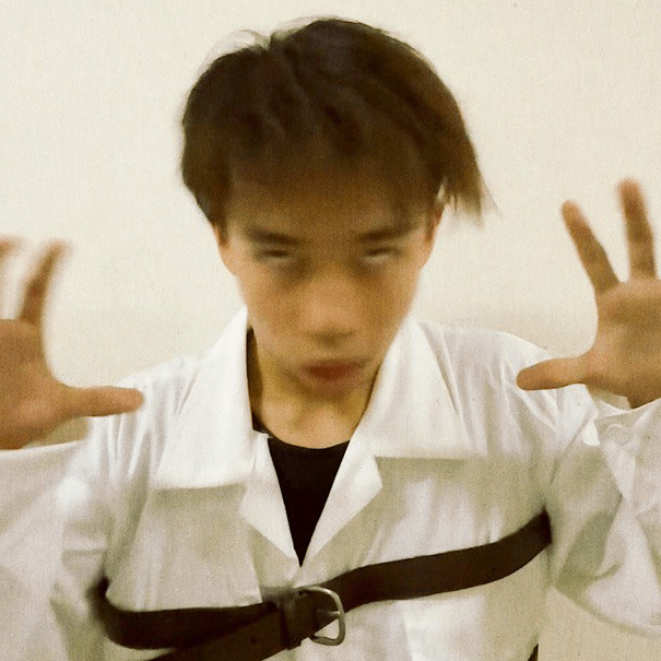 a man wearing a white collared shirt