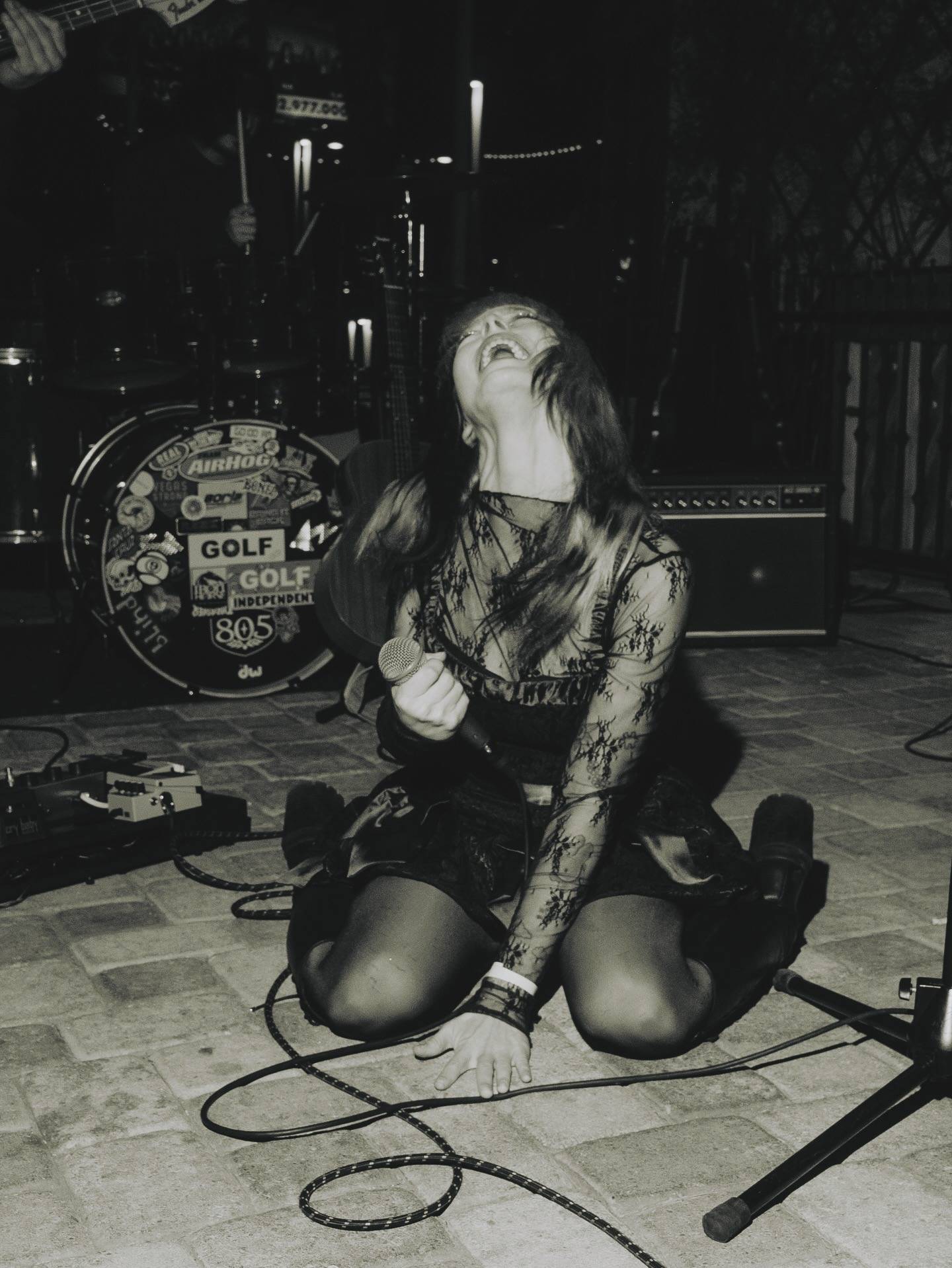 a woman is sitting on the ground