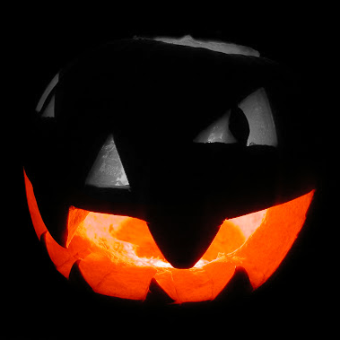 a jack o lantern is lit up in the dark