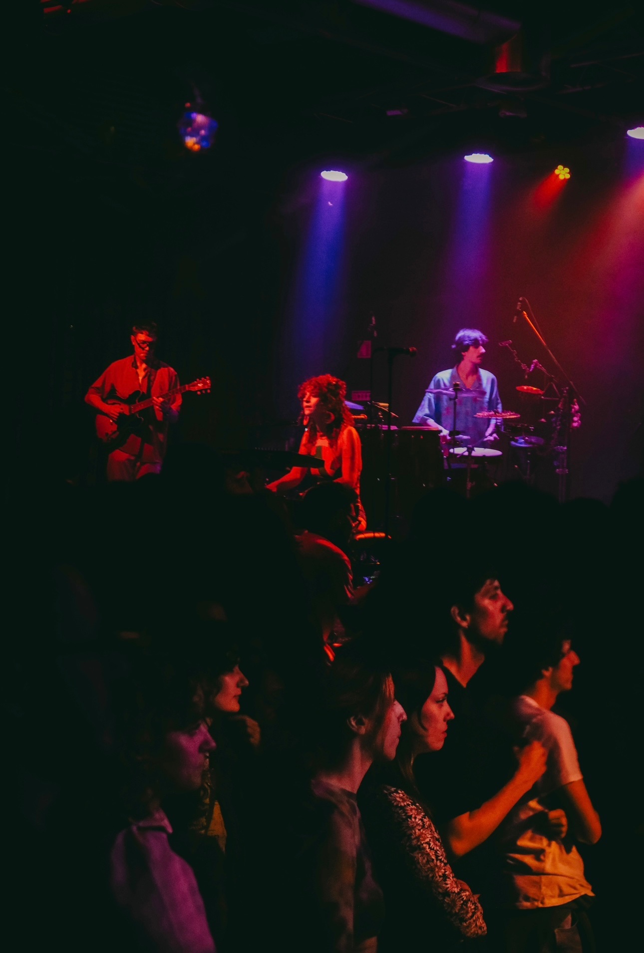 a group of people on stage at a concert