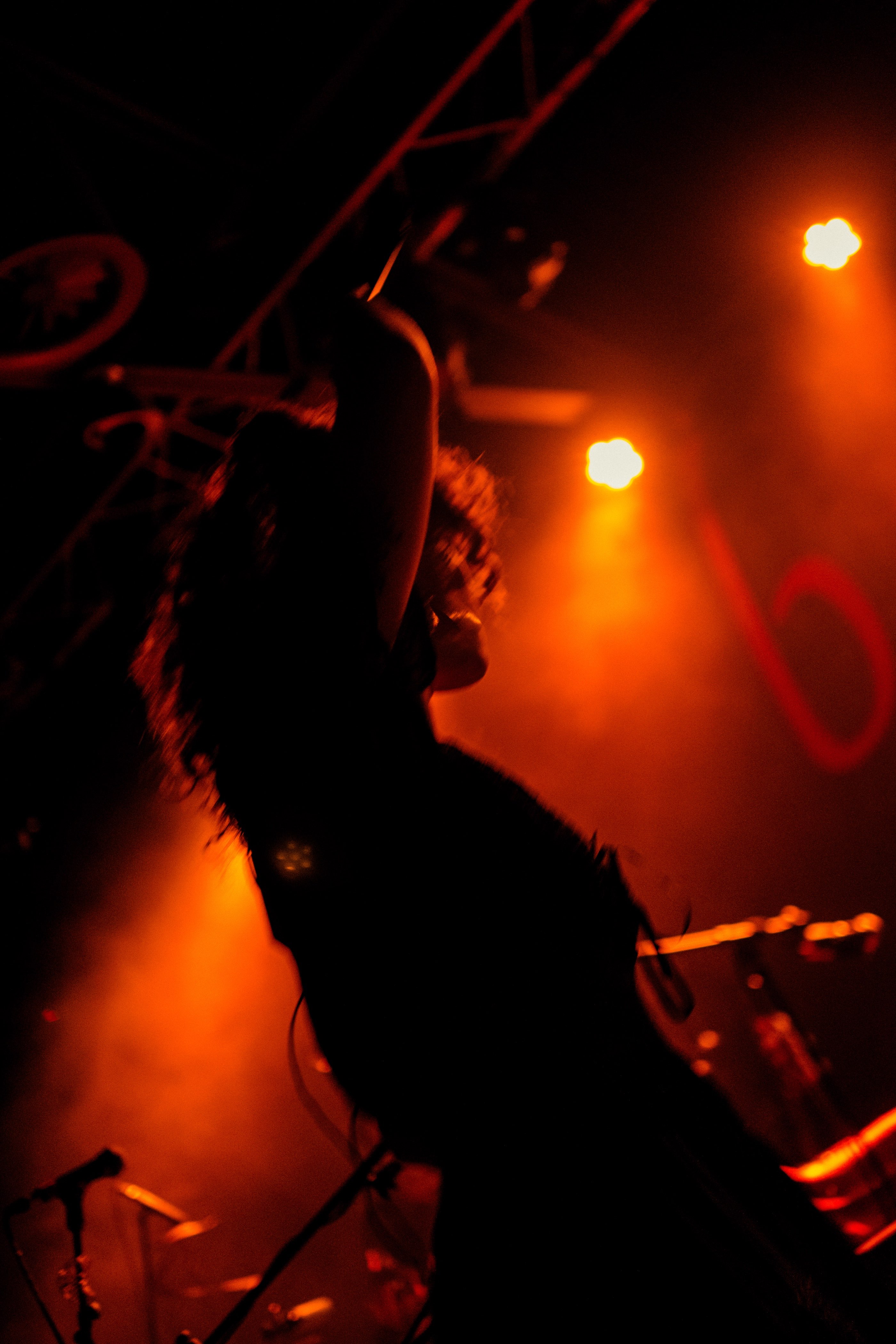 a woman is on stage at a concert
