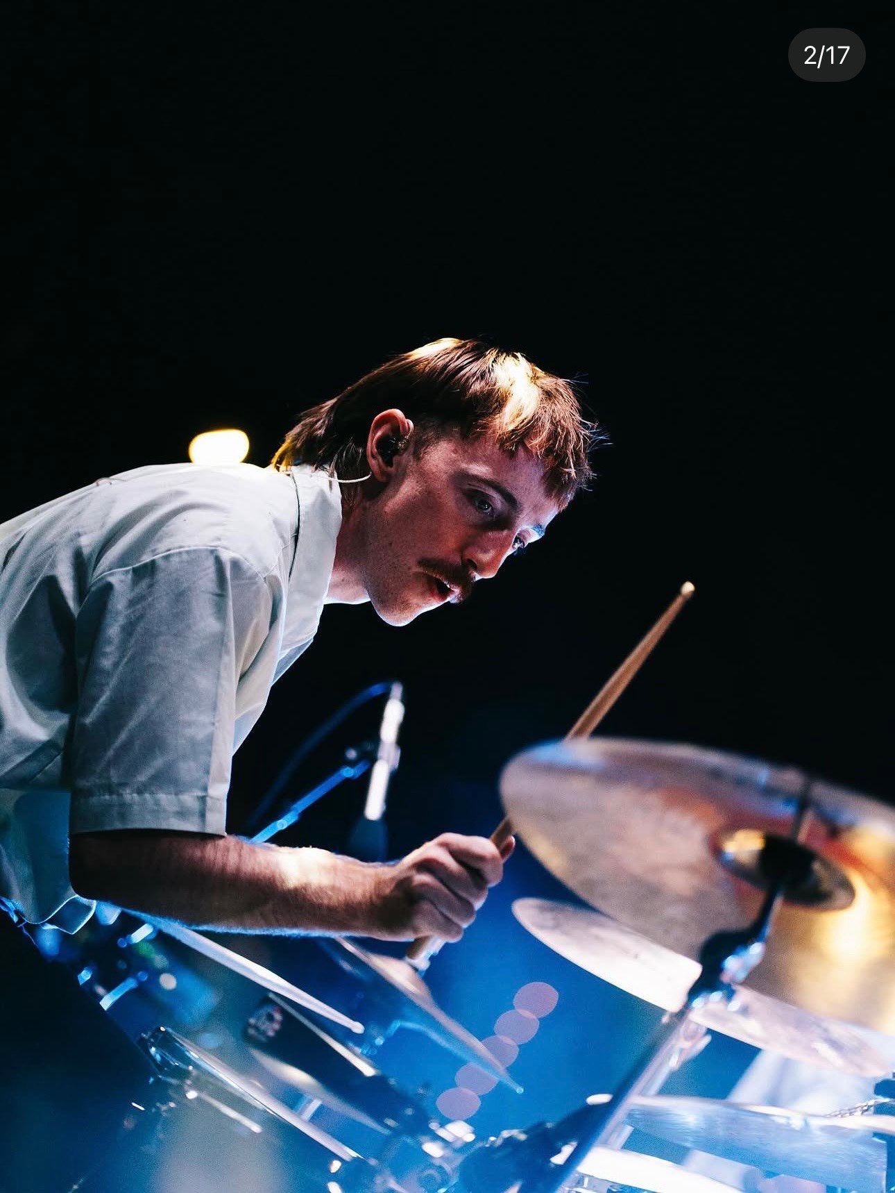a young man playing drums on stage