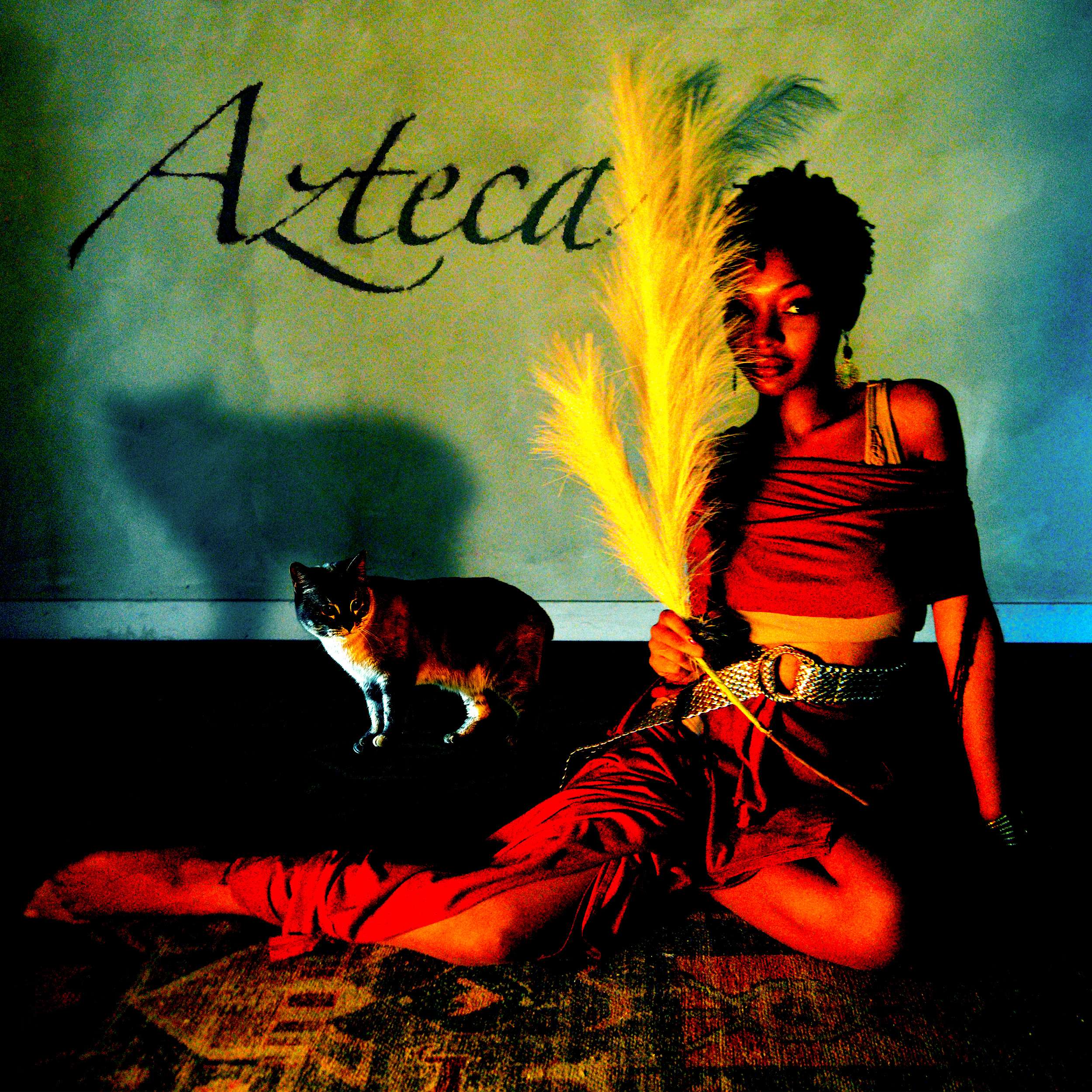 Menorah - Azteca: a woman in a red dress sitting on the floor with a cat