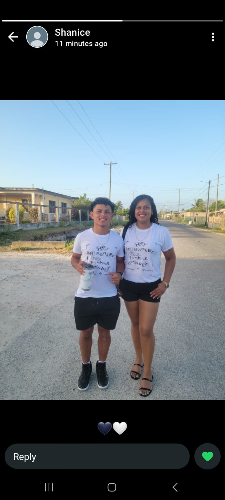 two people standing next to each other on a street