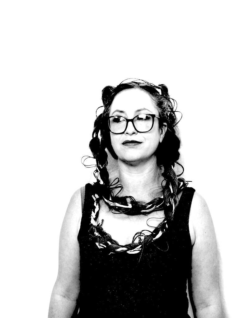 a black and white photo of a woman wearing glasses