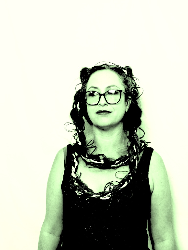 Laptop – An Intimate Instrument : a black and white photo of a woman wearing glasses