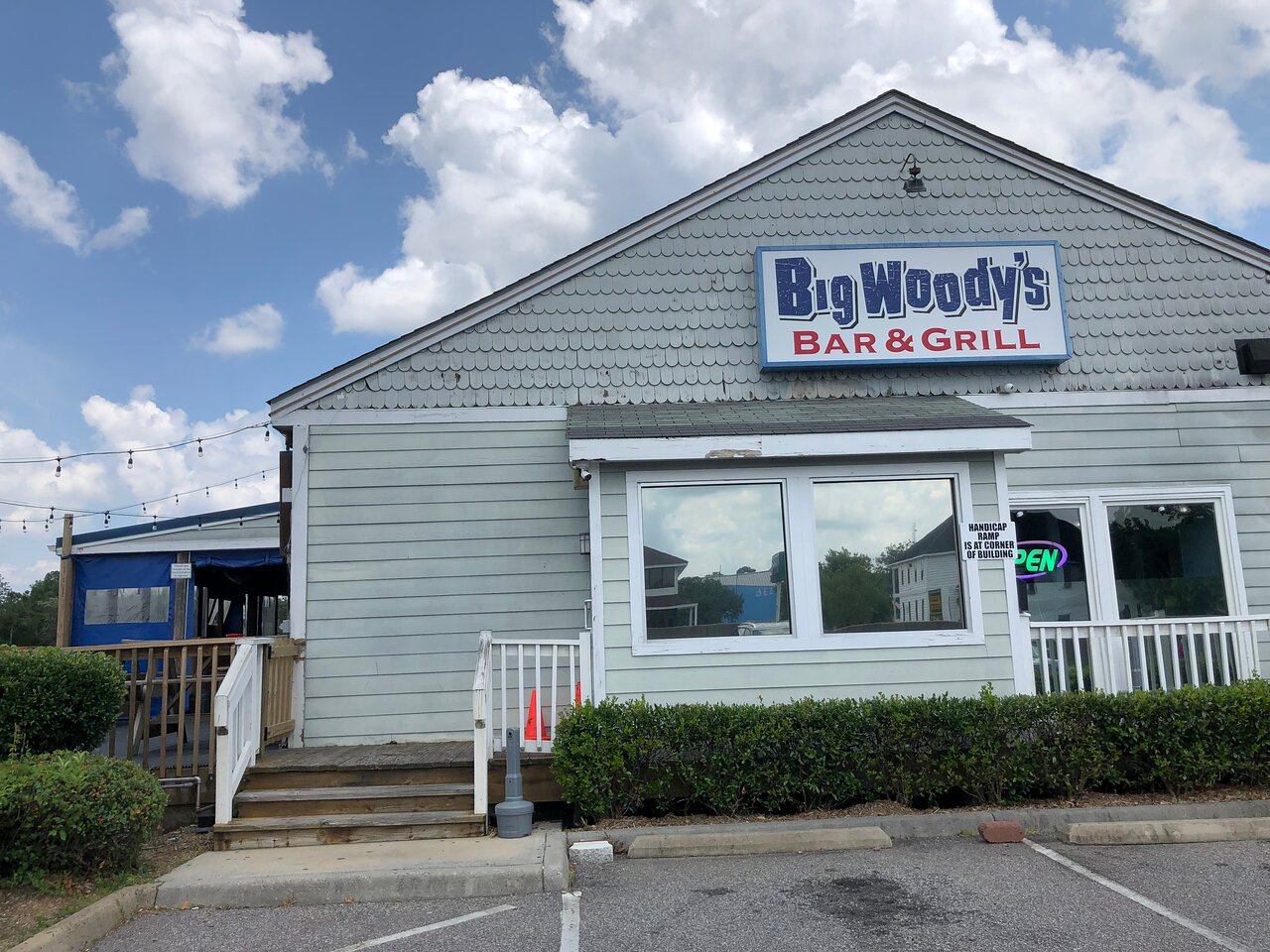 a building with a sign that reads beowulf's bar and grill
