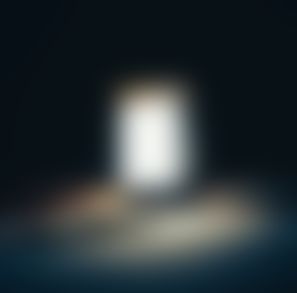 a blurry image of a white light in the dark