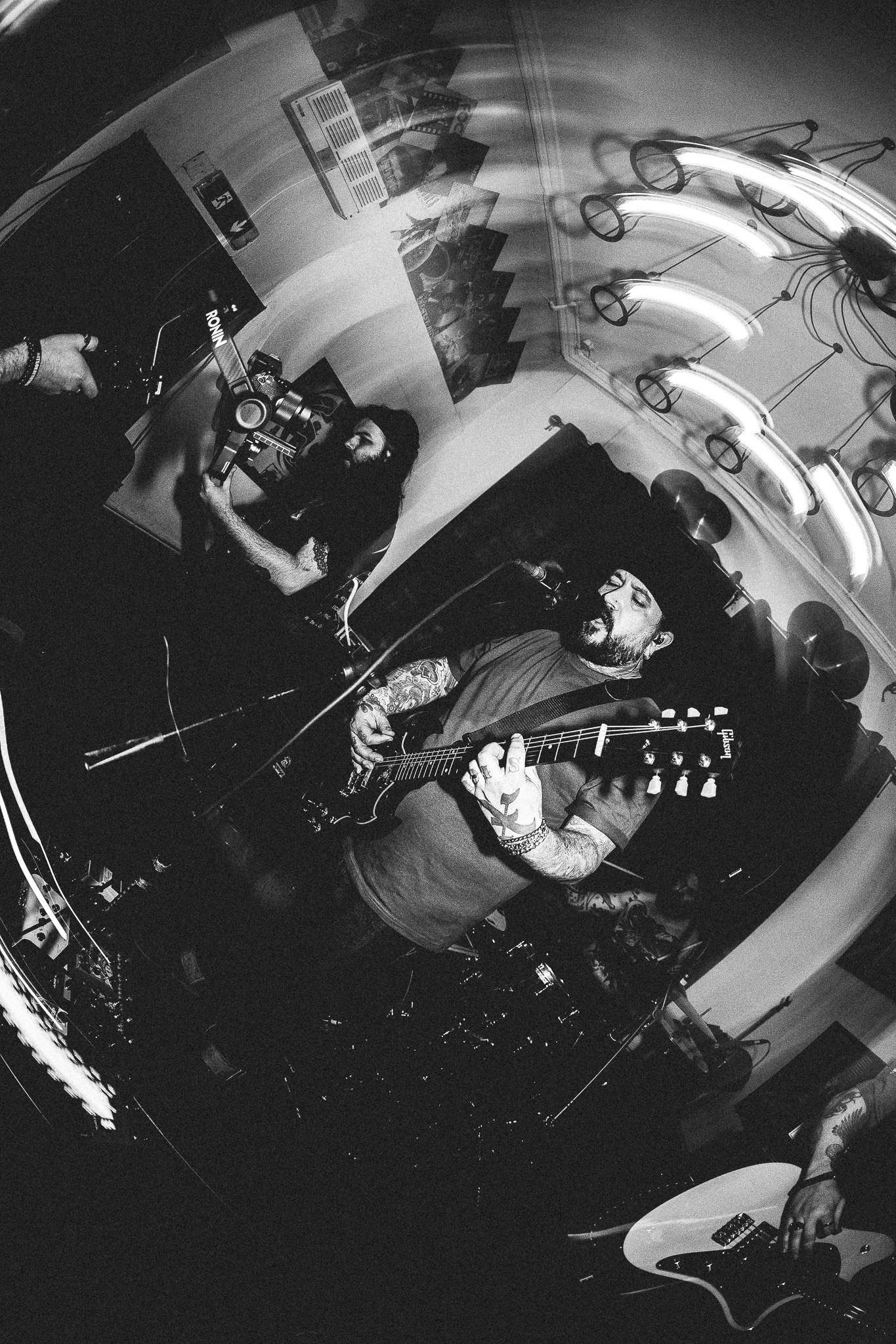 a black and white photo of a band playing music