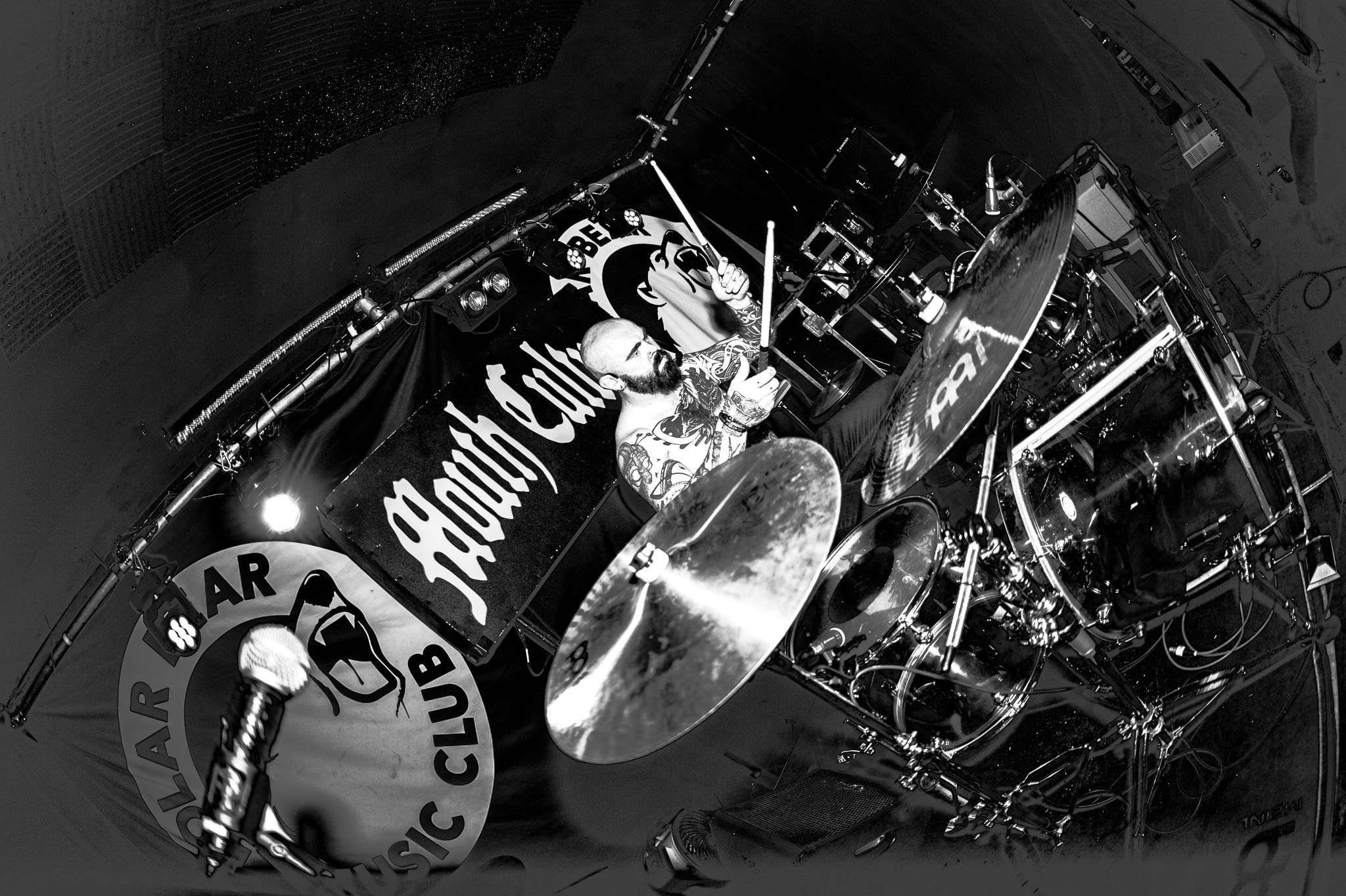 a black and white photo of a drum set