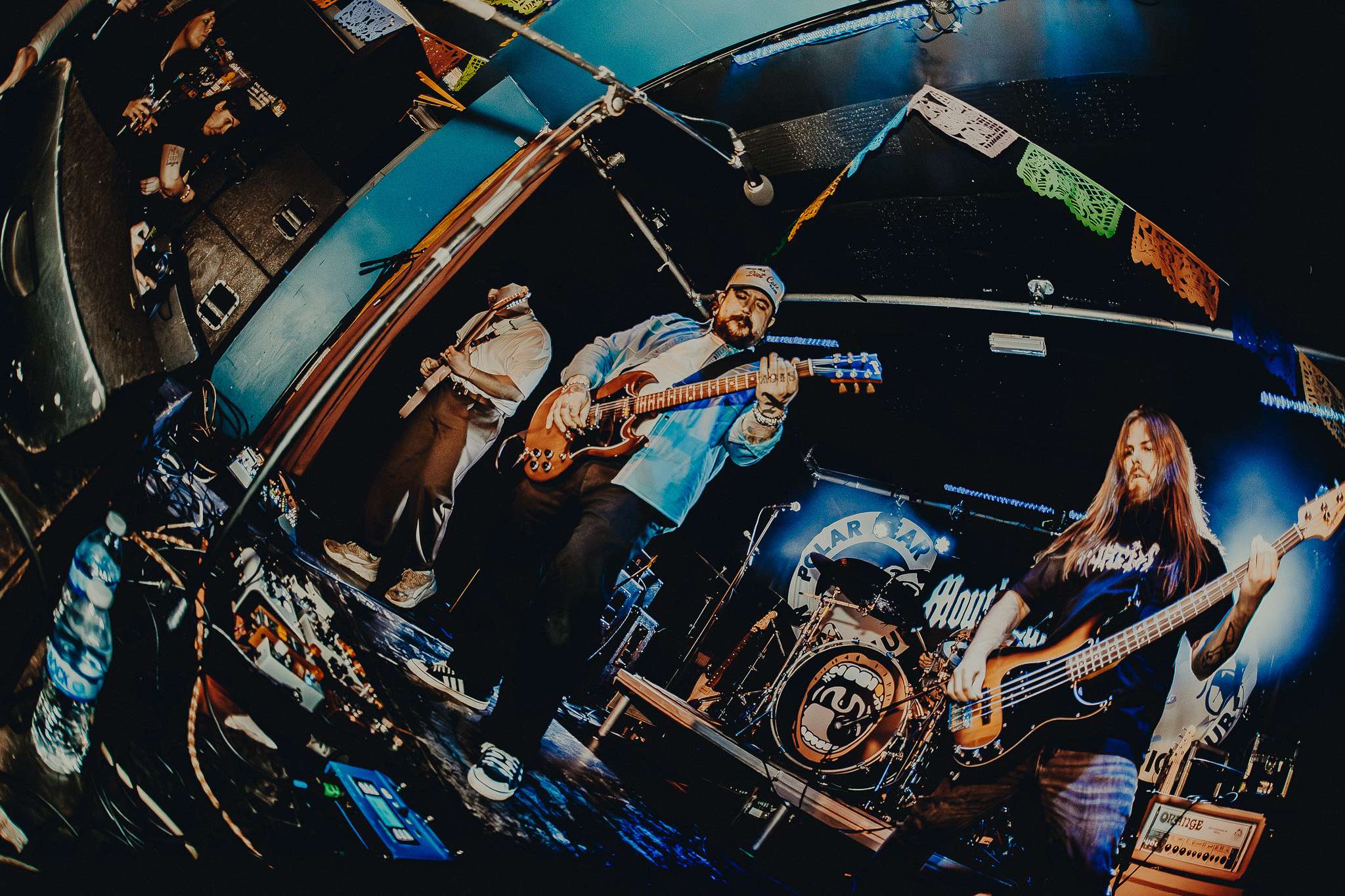 a group of people playing music in a room