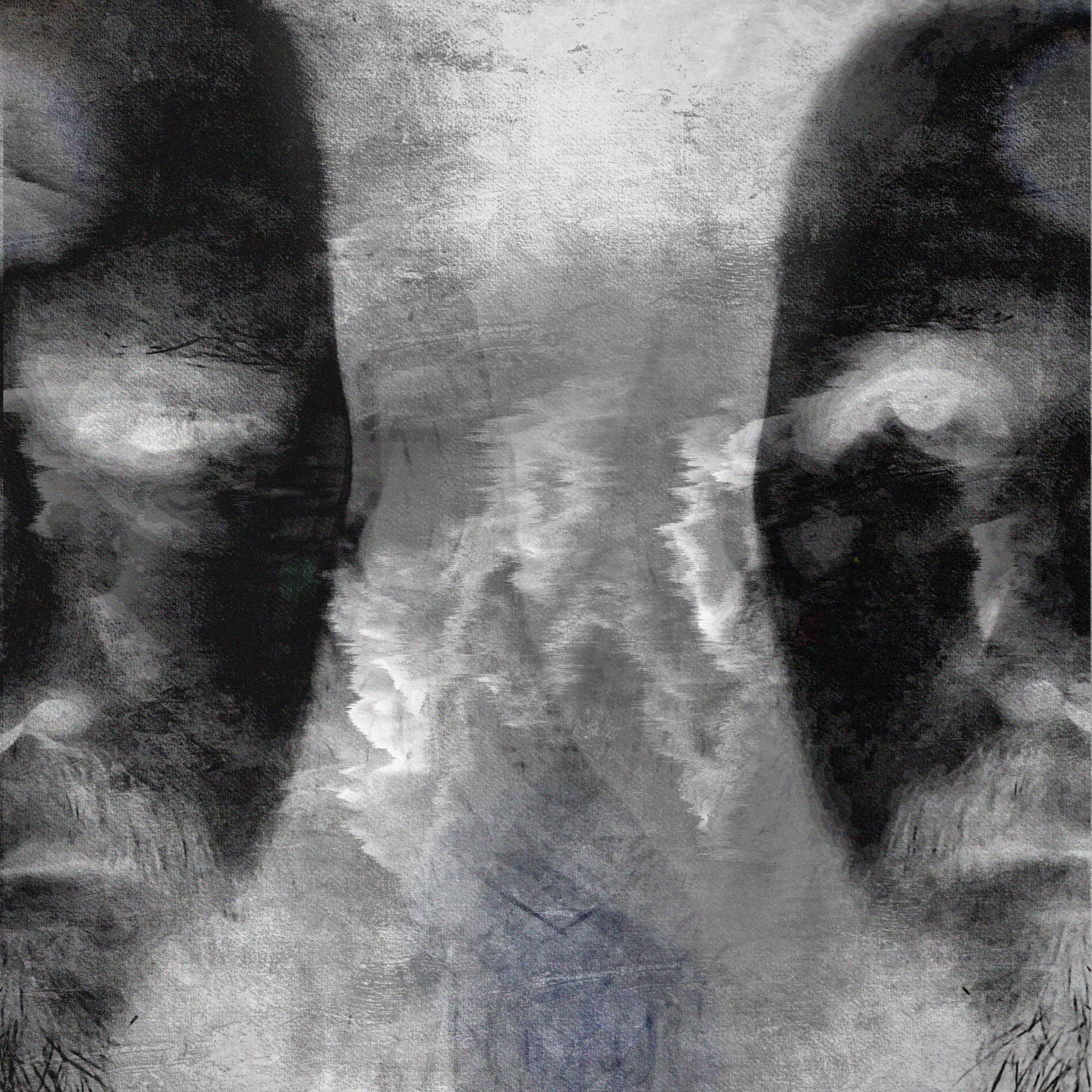 a black and white photo of a man with a beard