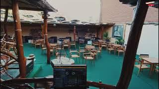 a view of a restaurant with tables and chairs