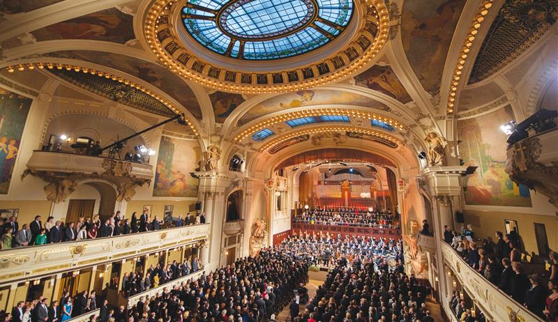 a crowd of people in an ornate building