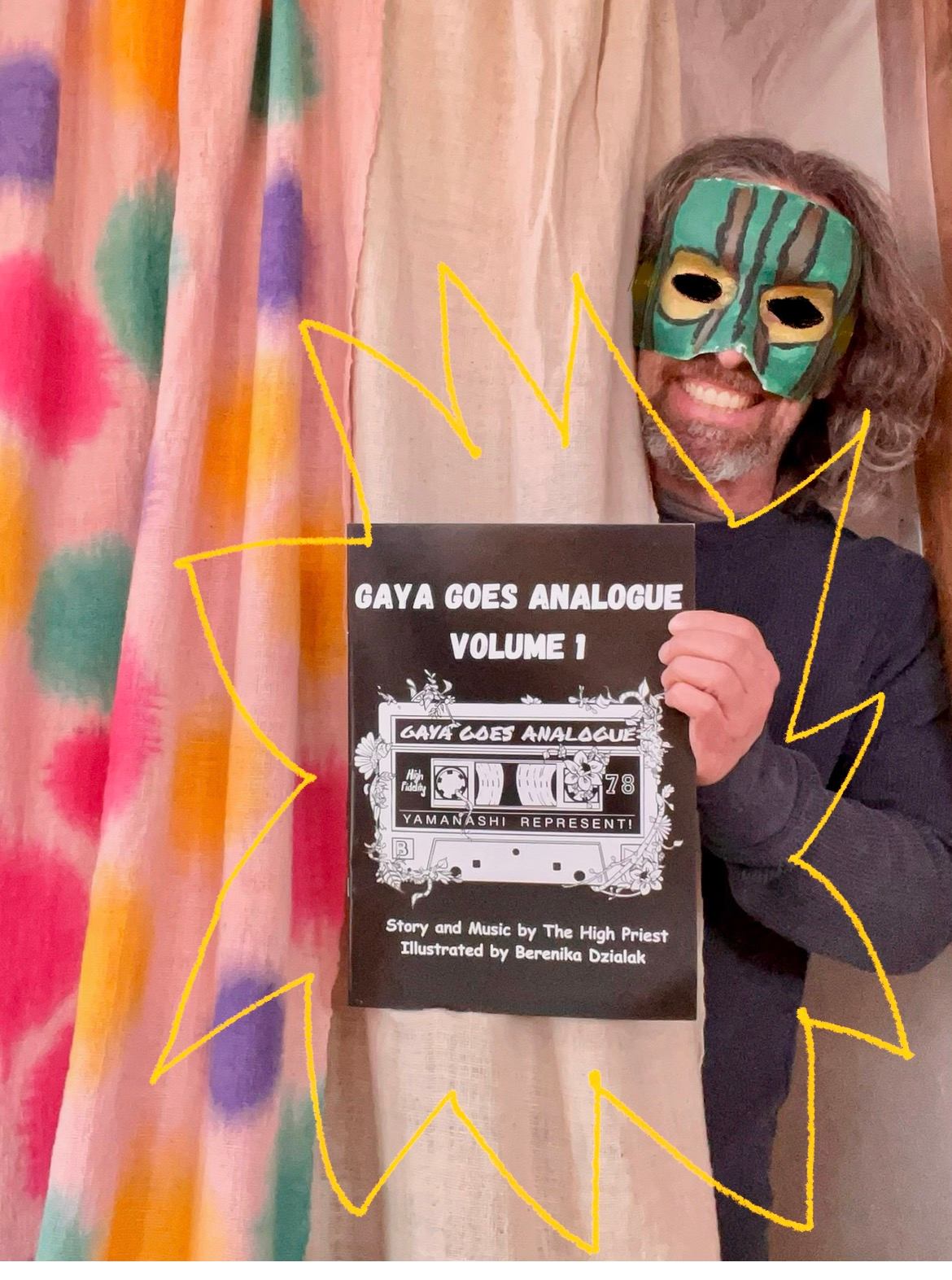 a man with a mask holding up a poster