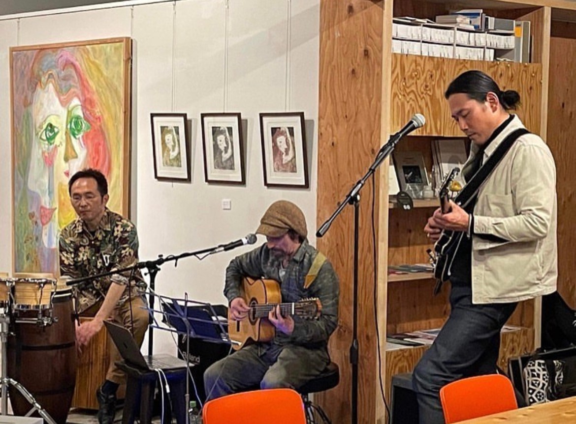 a group of people playing music in a room