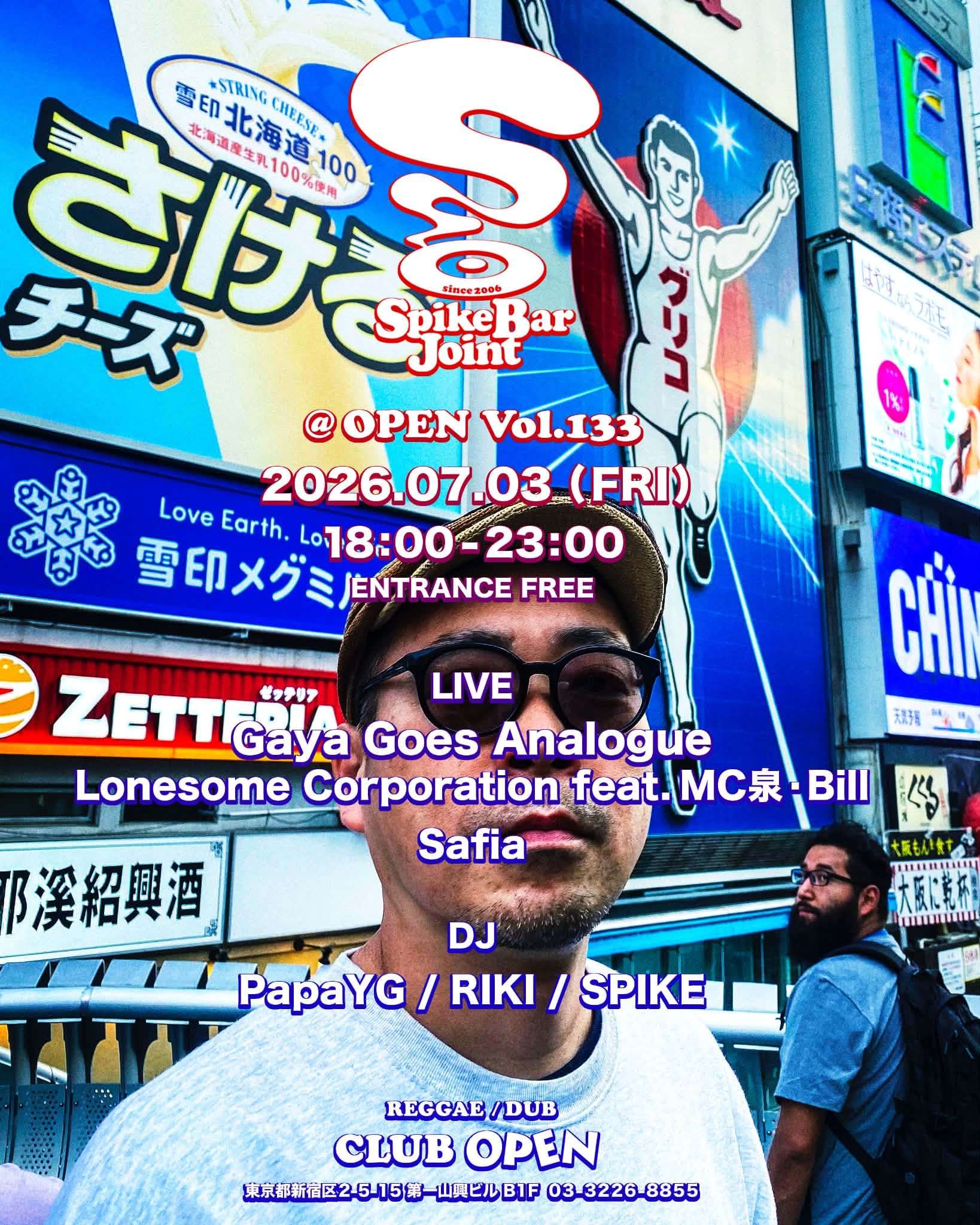 a man is standing in front of a billboard in a city