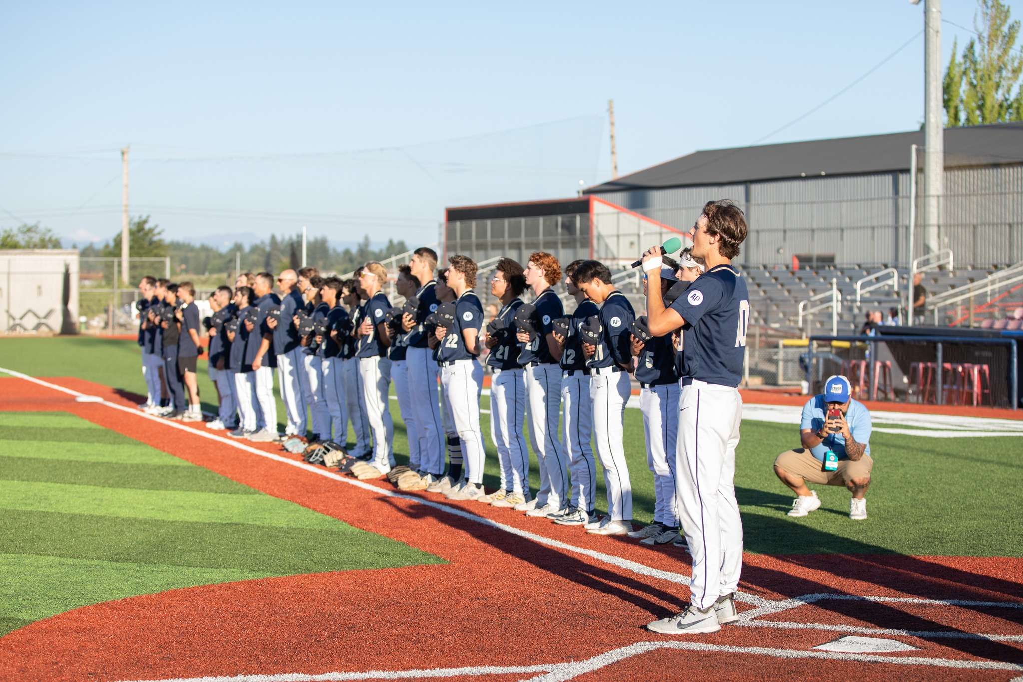 a group of baseball players standing on a field