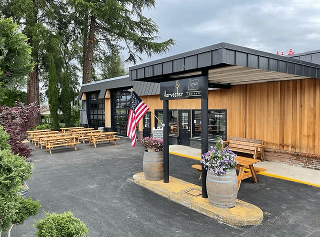 the front of a restaurant with tables and chairs