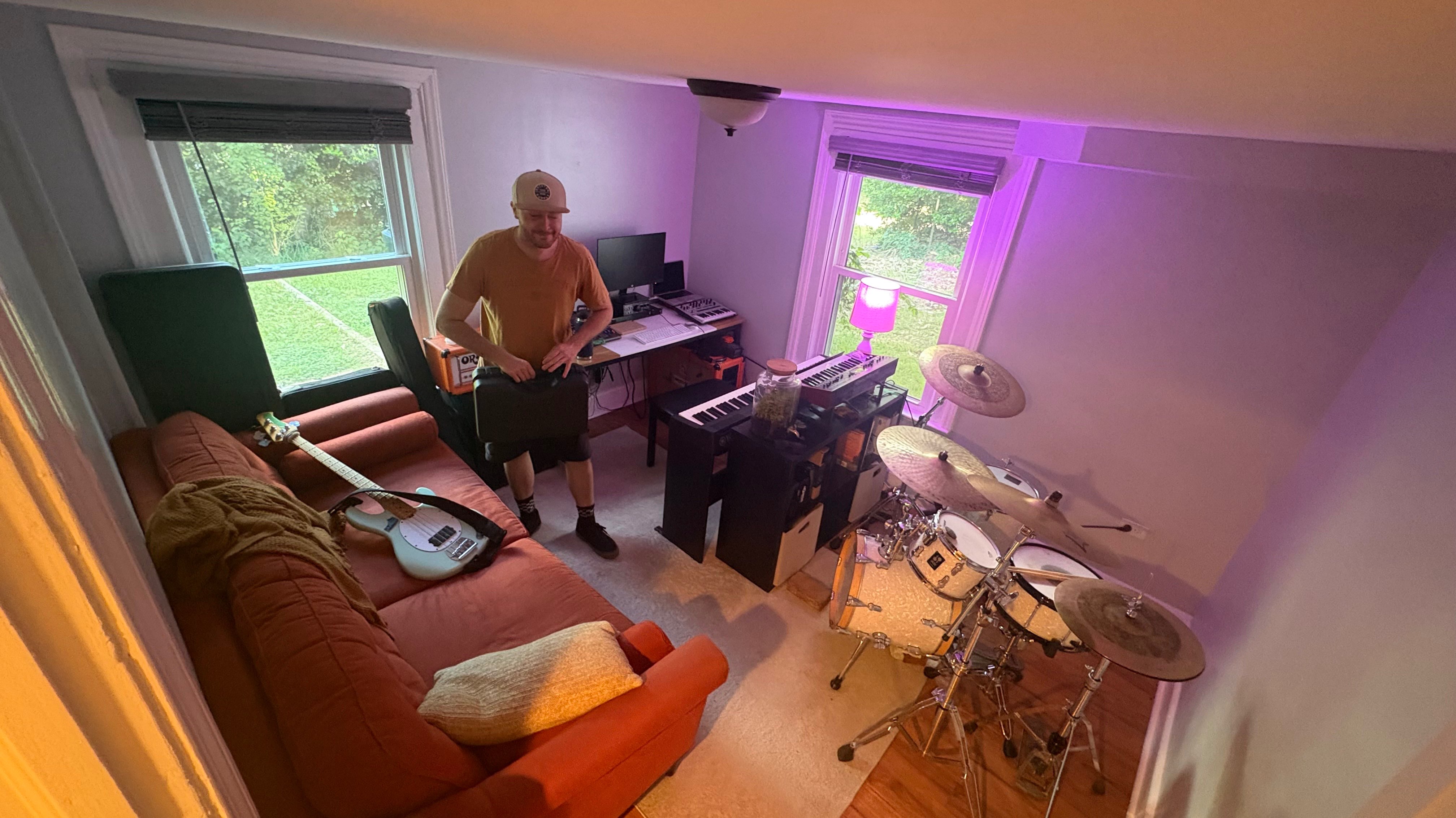 a man playing drums in a living room