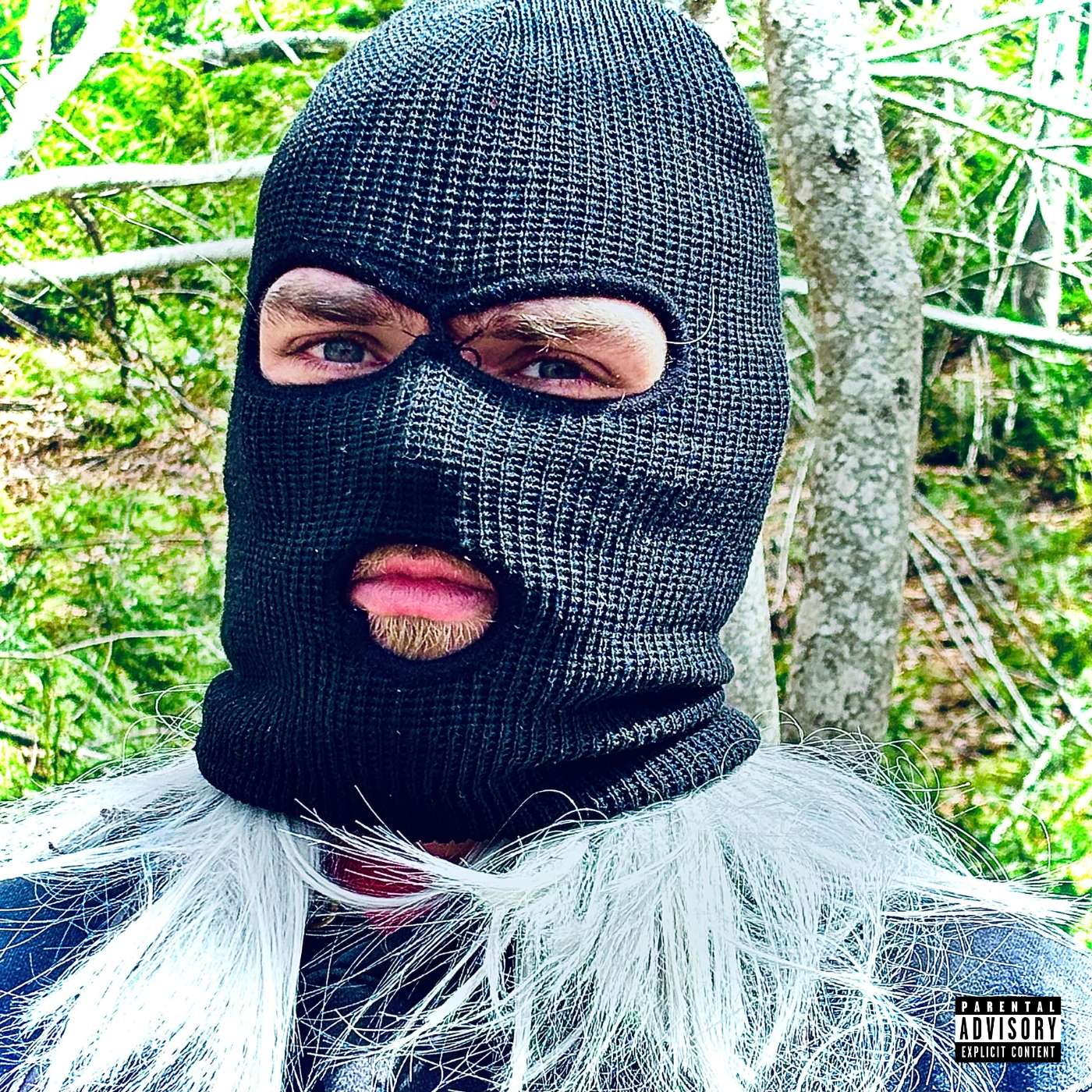 Tanyasson - ALASKA RIVER: a man wearing a ski mask in the woods