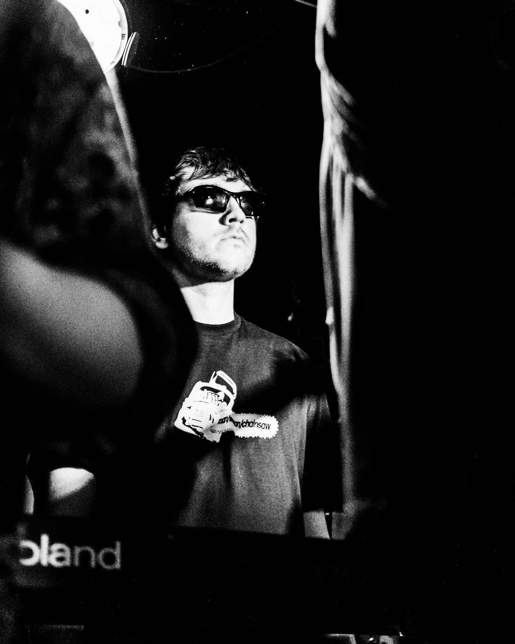 a black and white photo of a man wearing sunglasses