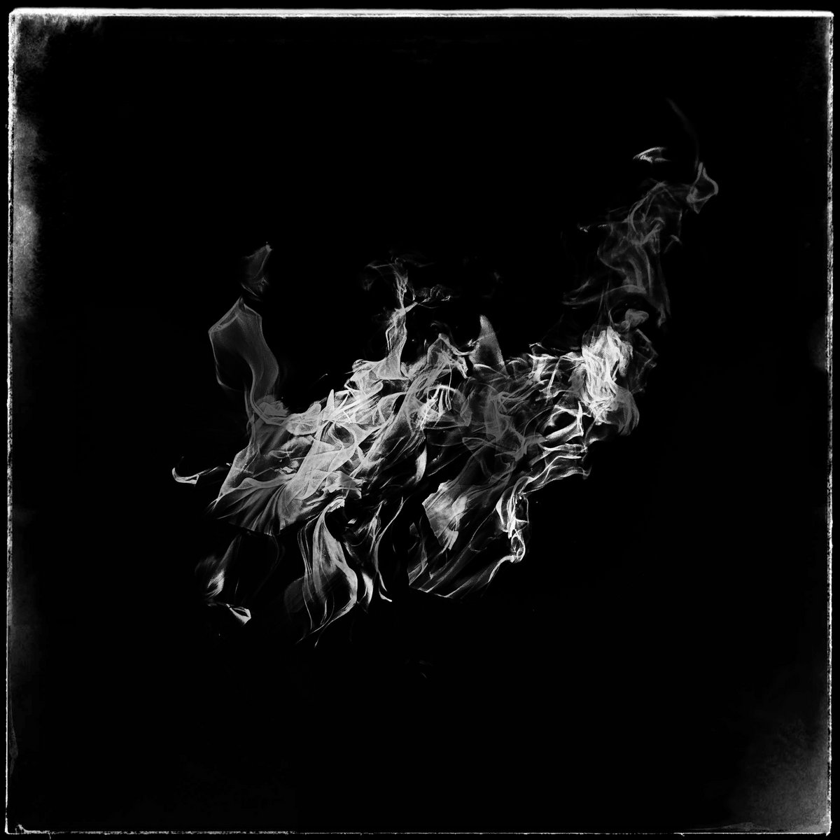 Astoria - Crystalize: a black and white photo of smoke on a black background
