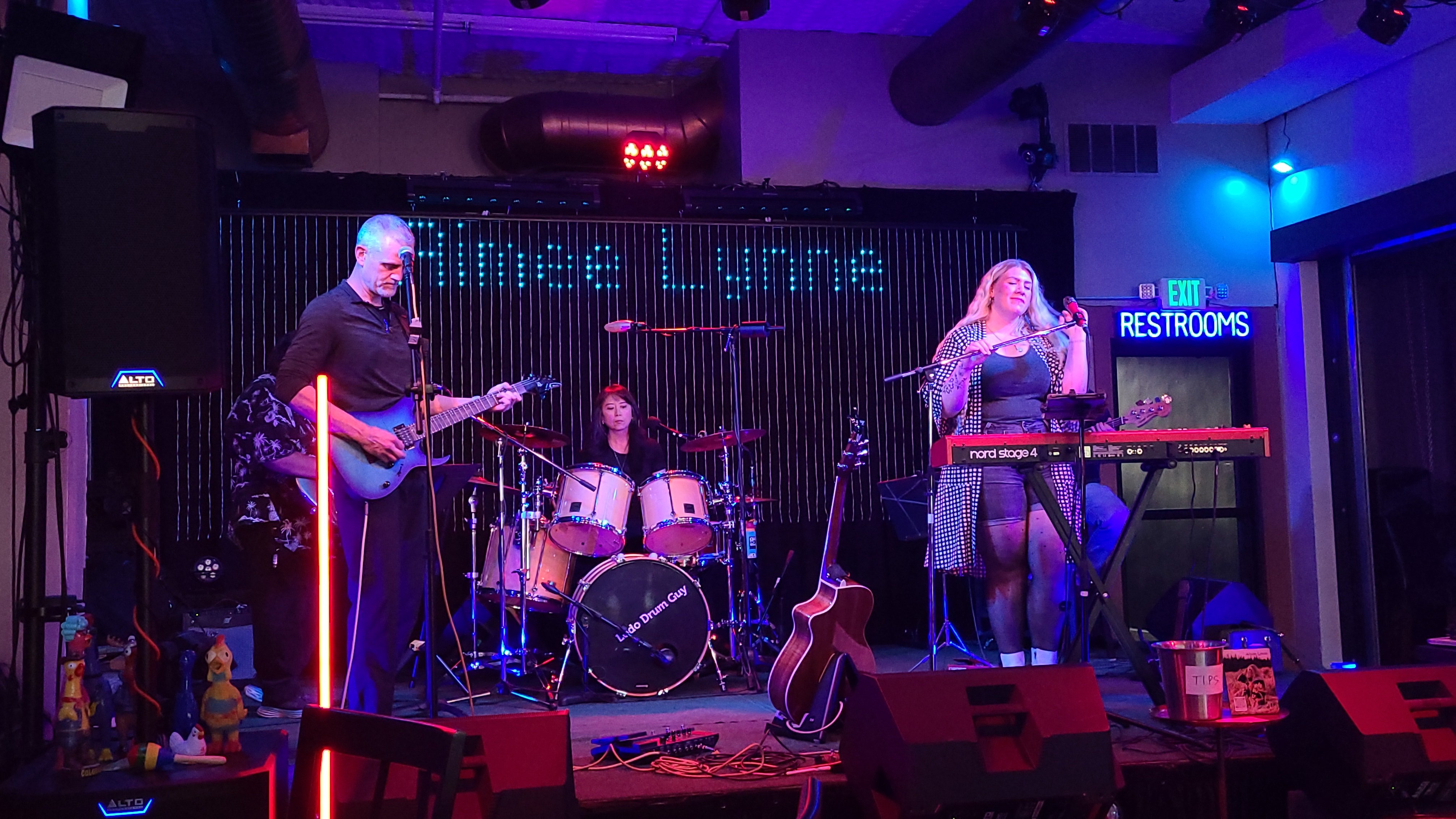 a group of people playing music in a room