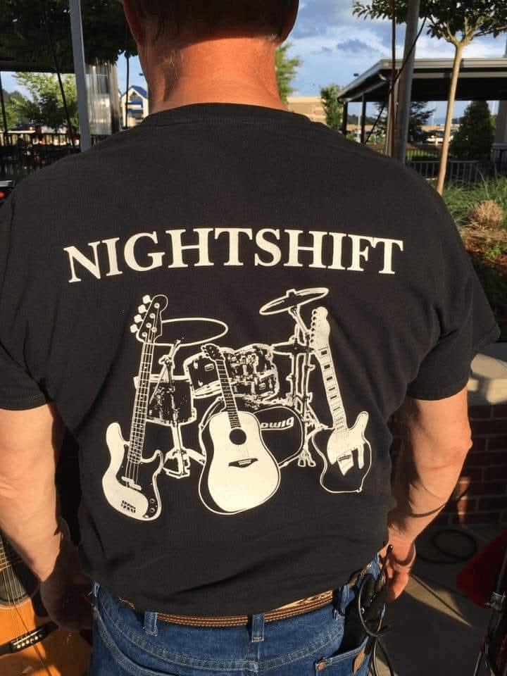 the back of a man wearing a nightshift t - shirt