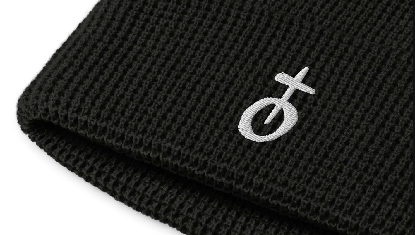 a black beanie with a cross on it