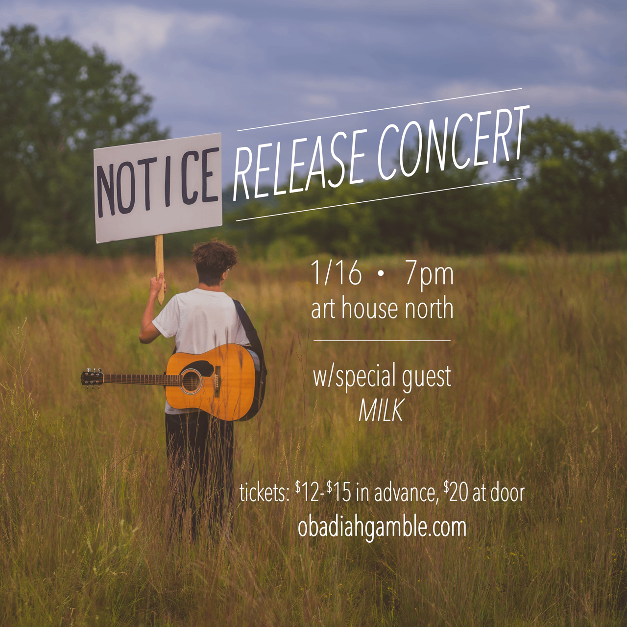 a man holding an acoustic guitar in a field with a sign that says not ice release concert