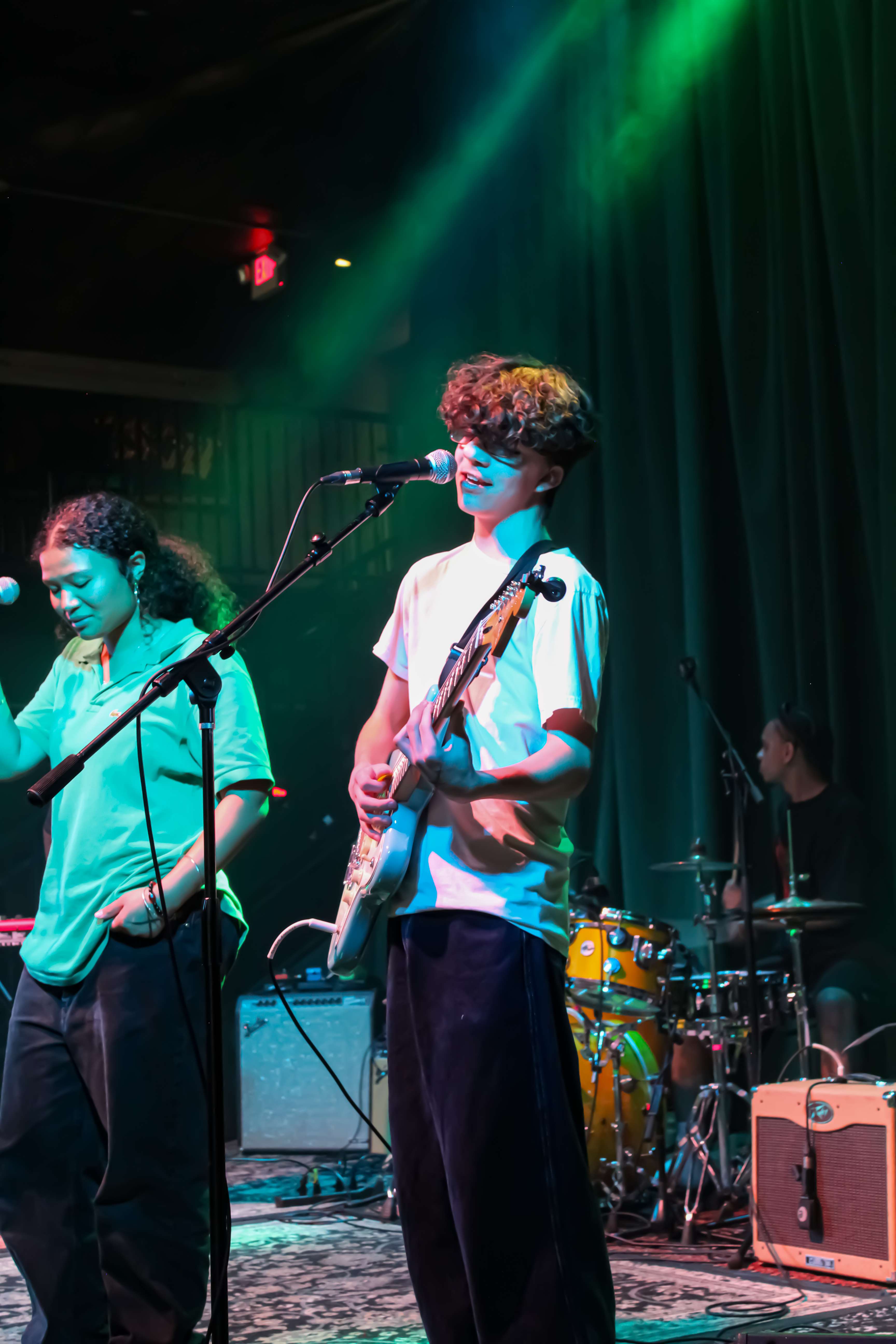 a group of people standing on stage