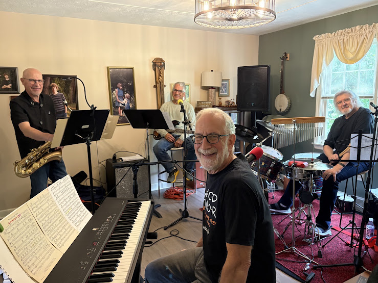 a group of musicians playing music in a living room