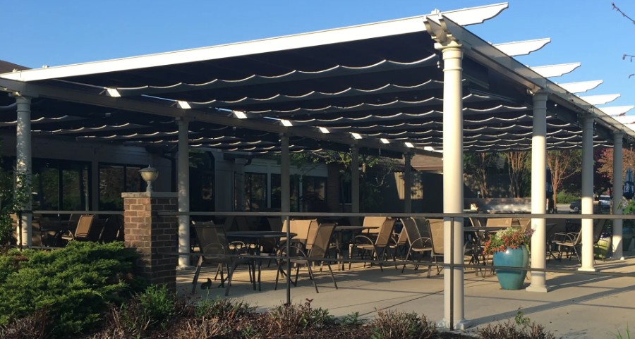 a patio covered with a black awning