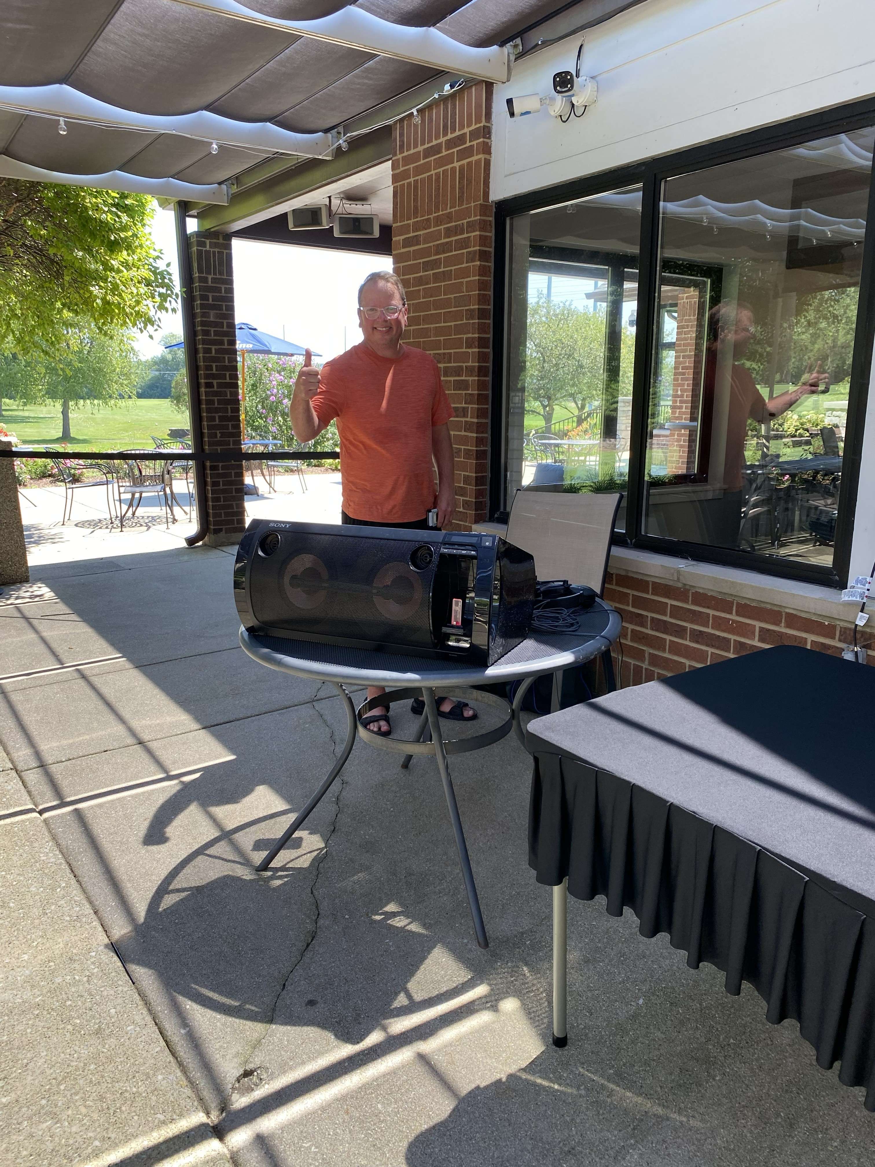 a man standing in front of a table