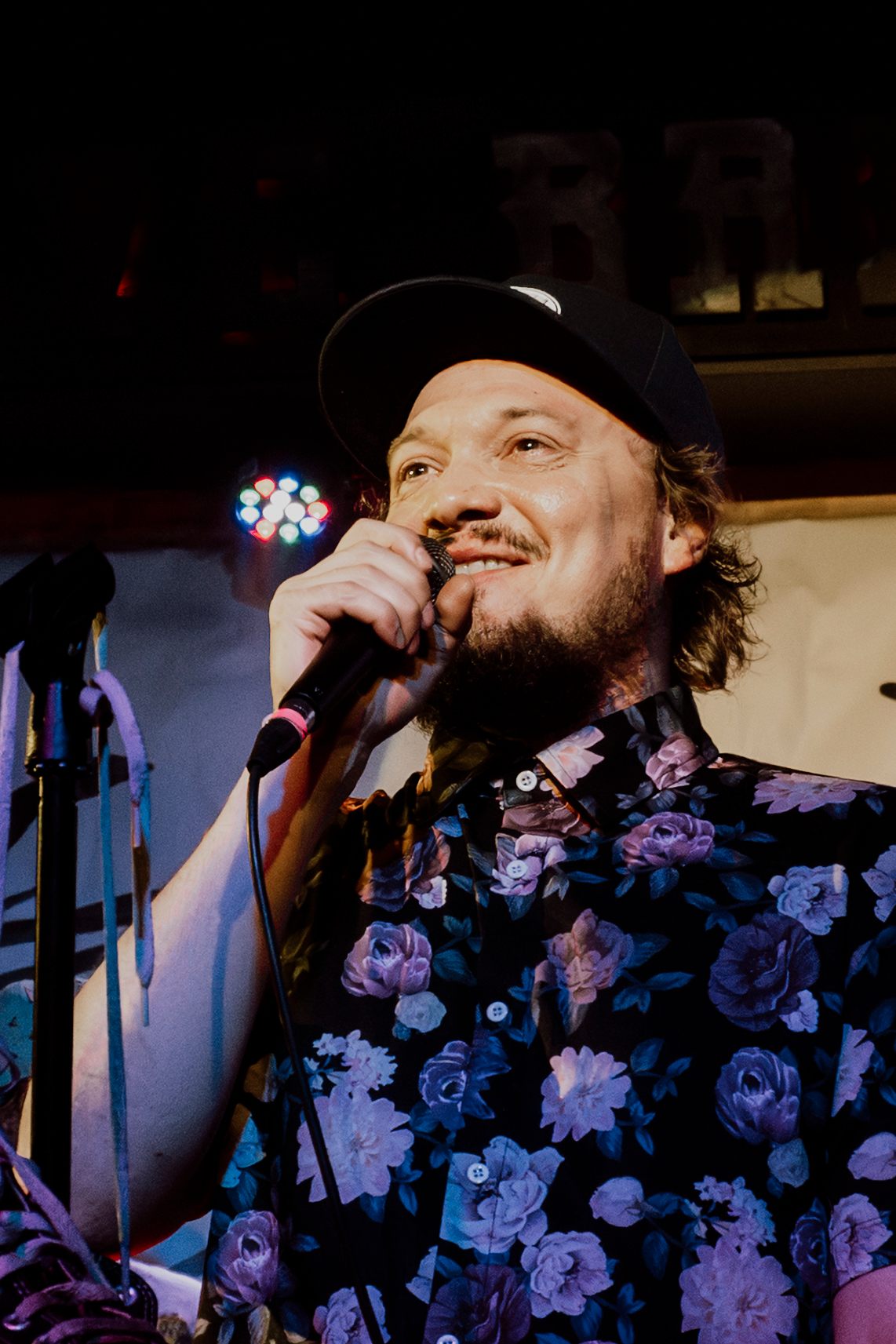 a man is singing into a microphone