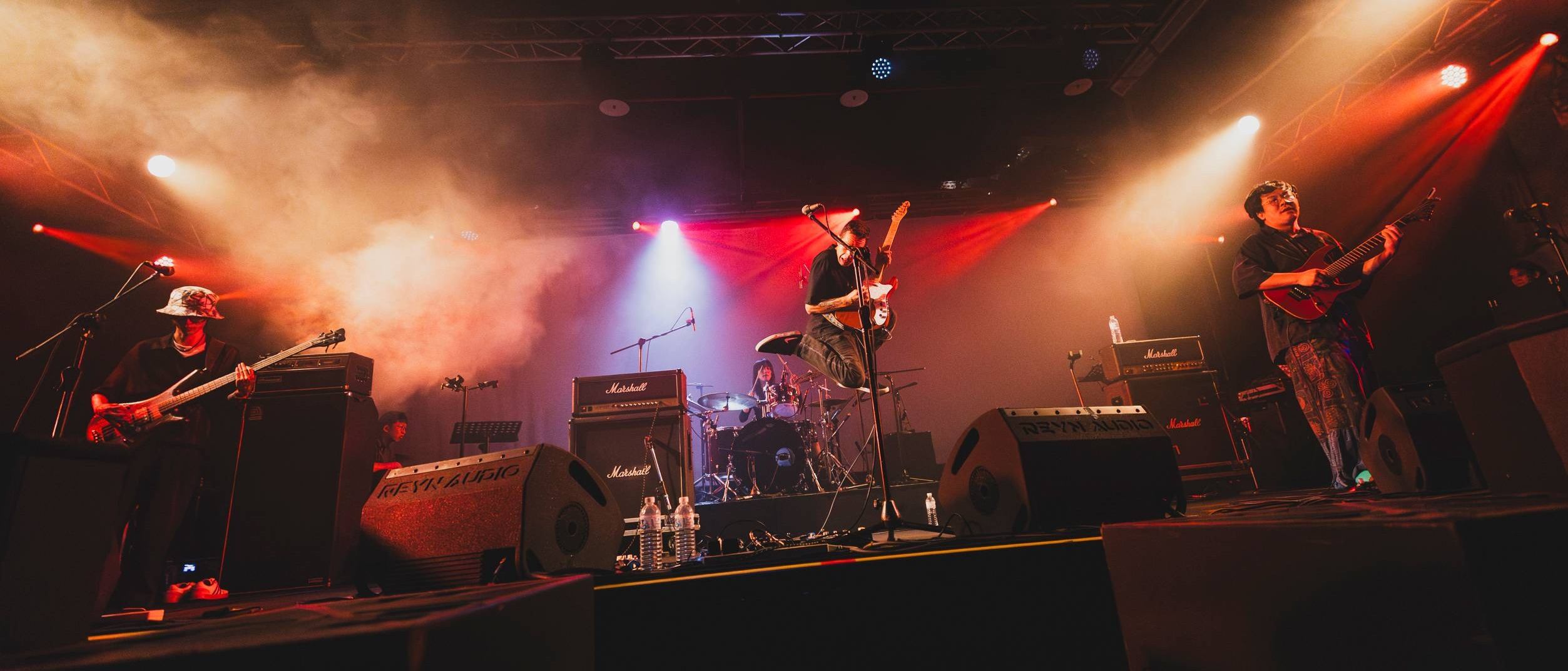 a group of musicians on stage at a concert
