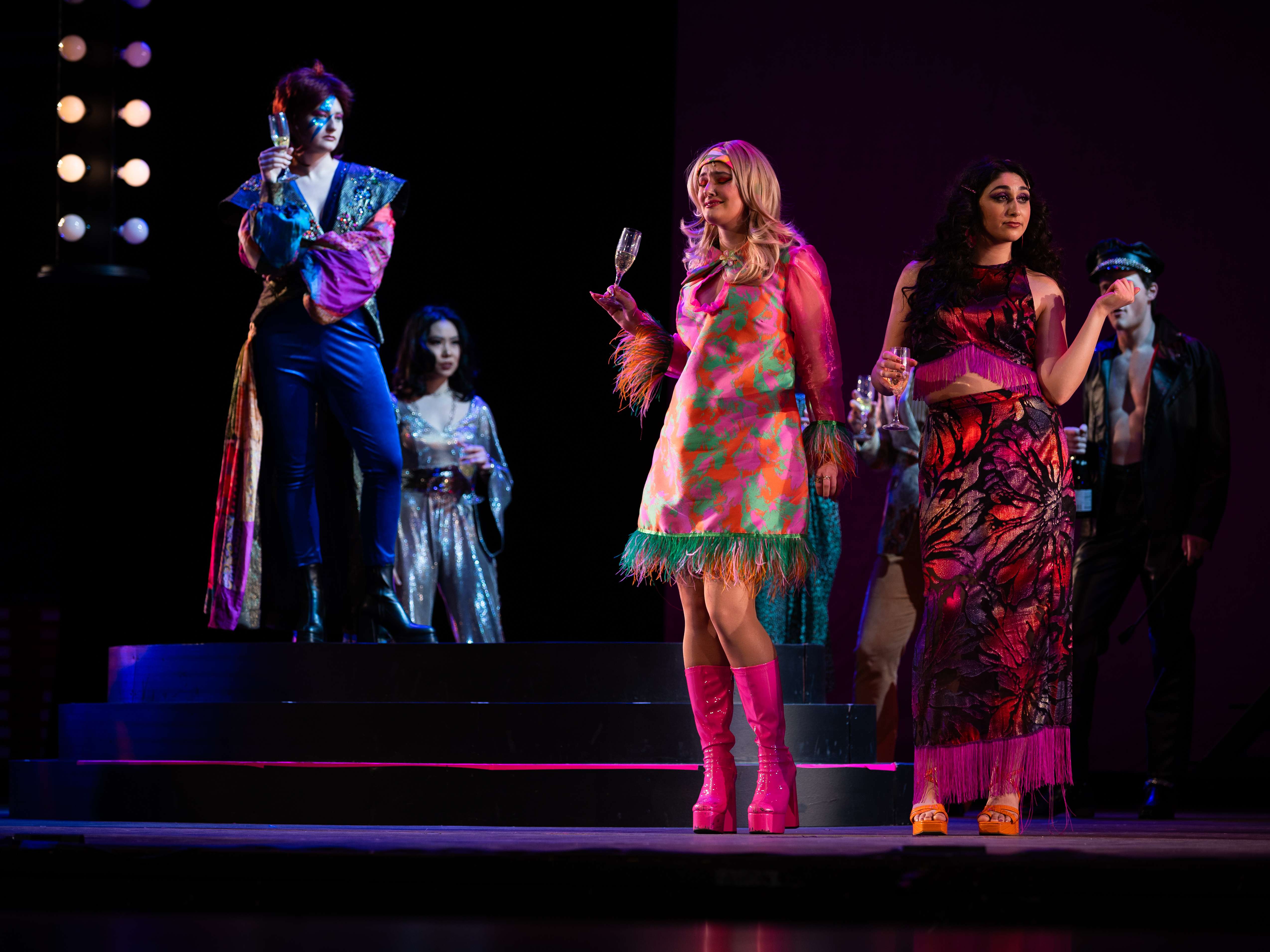 a group of people standing on a stage