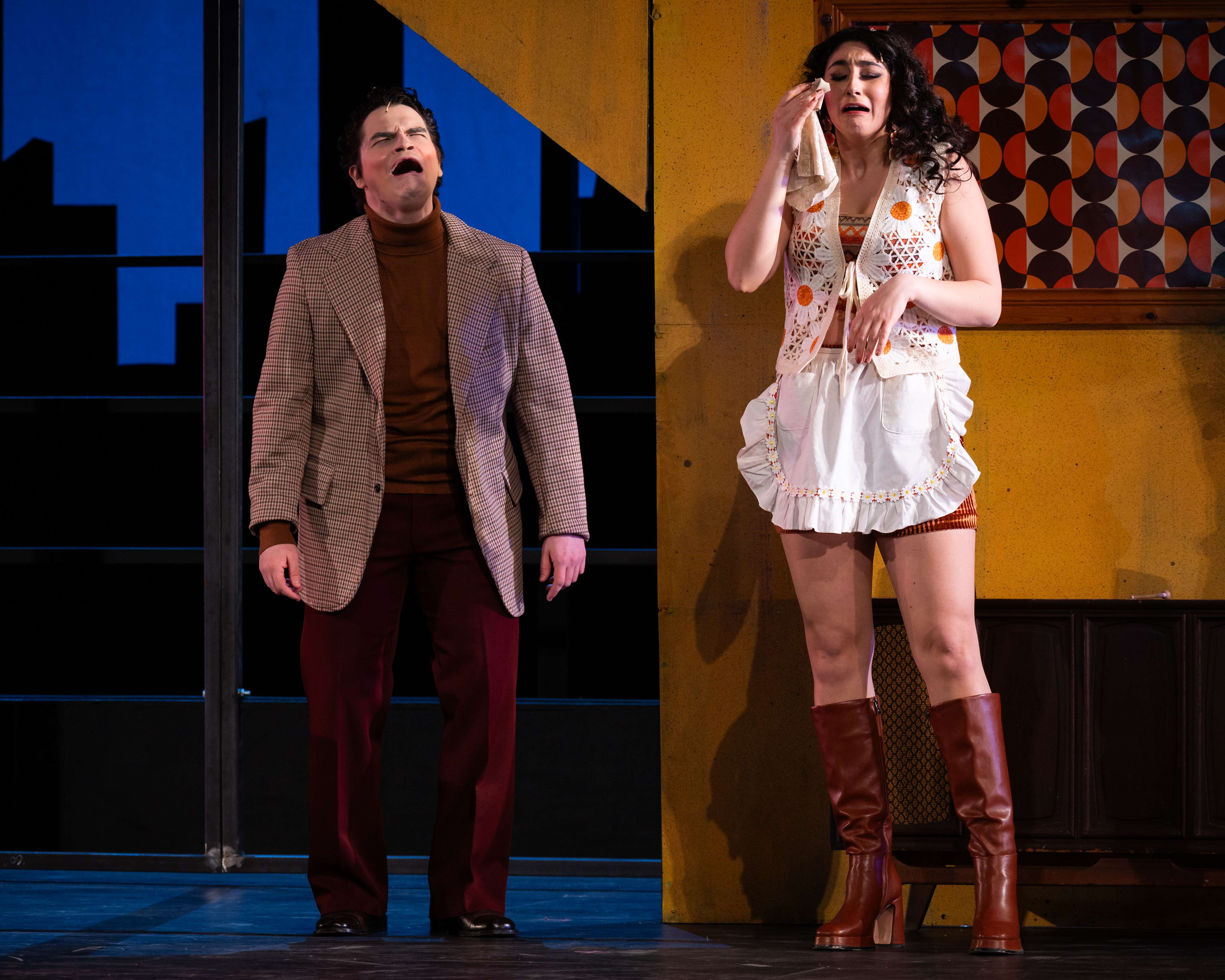 a man and a woman standing on a stage