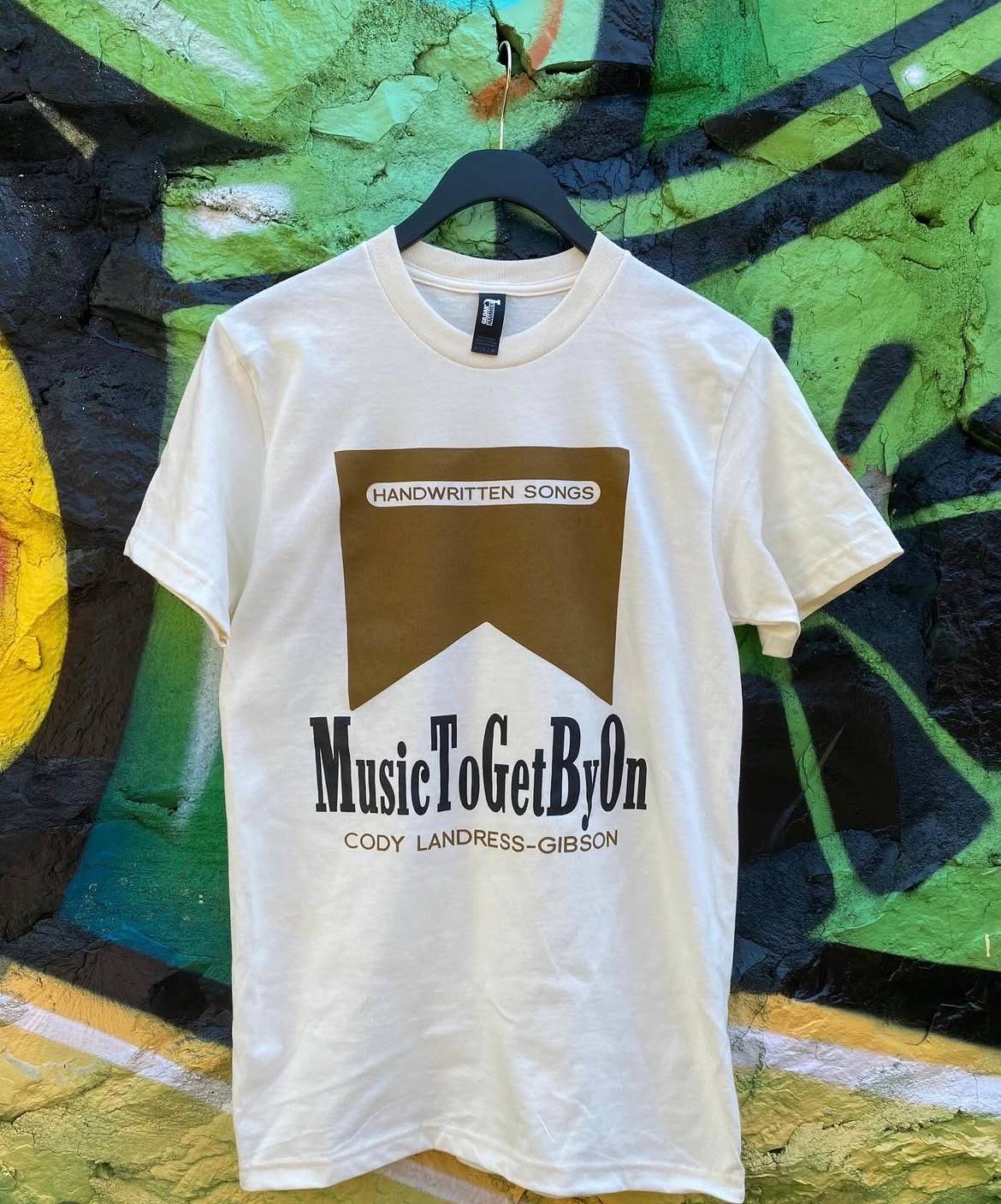 a white t - shirt that says music token by